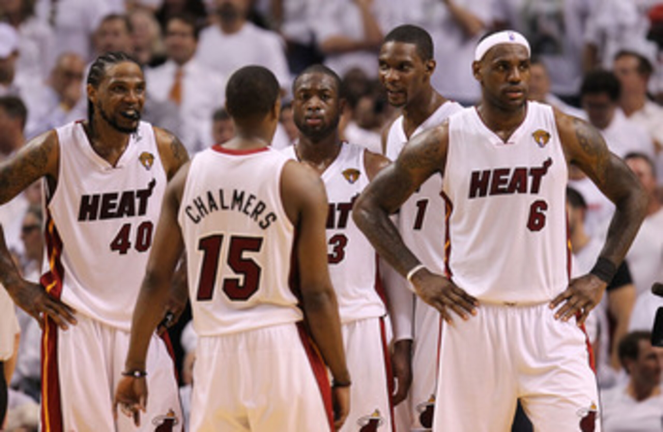 MIAMI, FL - MAY 31:  (R) LeBron James #6 of the Miami Heat reacts with teammates Mario Chalmers #15, Dwyane Wade #3, Chris Bosh #1 and Udonis Haslem #40 in the fourth quarter while taking on the Dallas Mavericks in Game One of the 2011 NBA Finals at Ameri