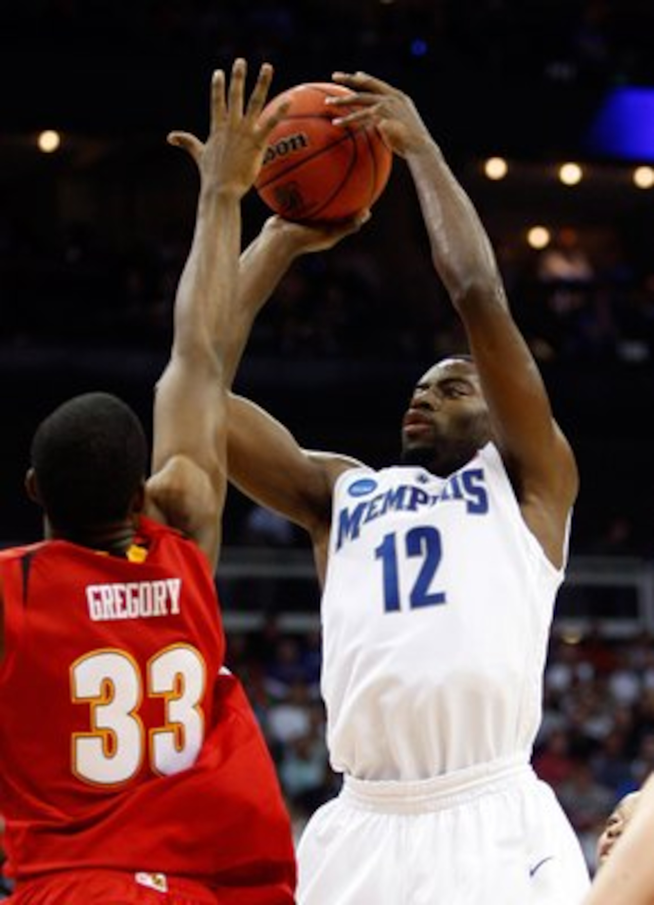 KANSAS CITY, MO - MARCH 21: Tyreke Evans #12 of the Memphis Tigers sets up for a shot attempt during their second round game against the Maryland Terrapins in the NCAA Division I Men's Basketball Tournament at the Sprint Center on March 21, 2009 in Kansa KANSAS CITY, MO - MARCH 21: Tyreke Evans #12 of the Memphis Tigers sets up for a shot attempt during their second round game against the Maryland Terrapins in the NCAA Division I Men's Basketball Tournament at the Sprint Center on March 21, 2009 in Kansa