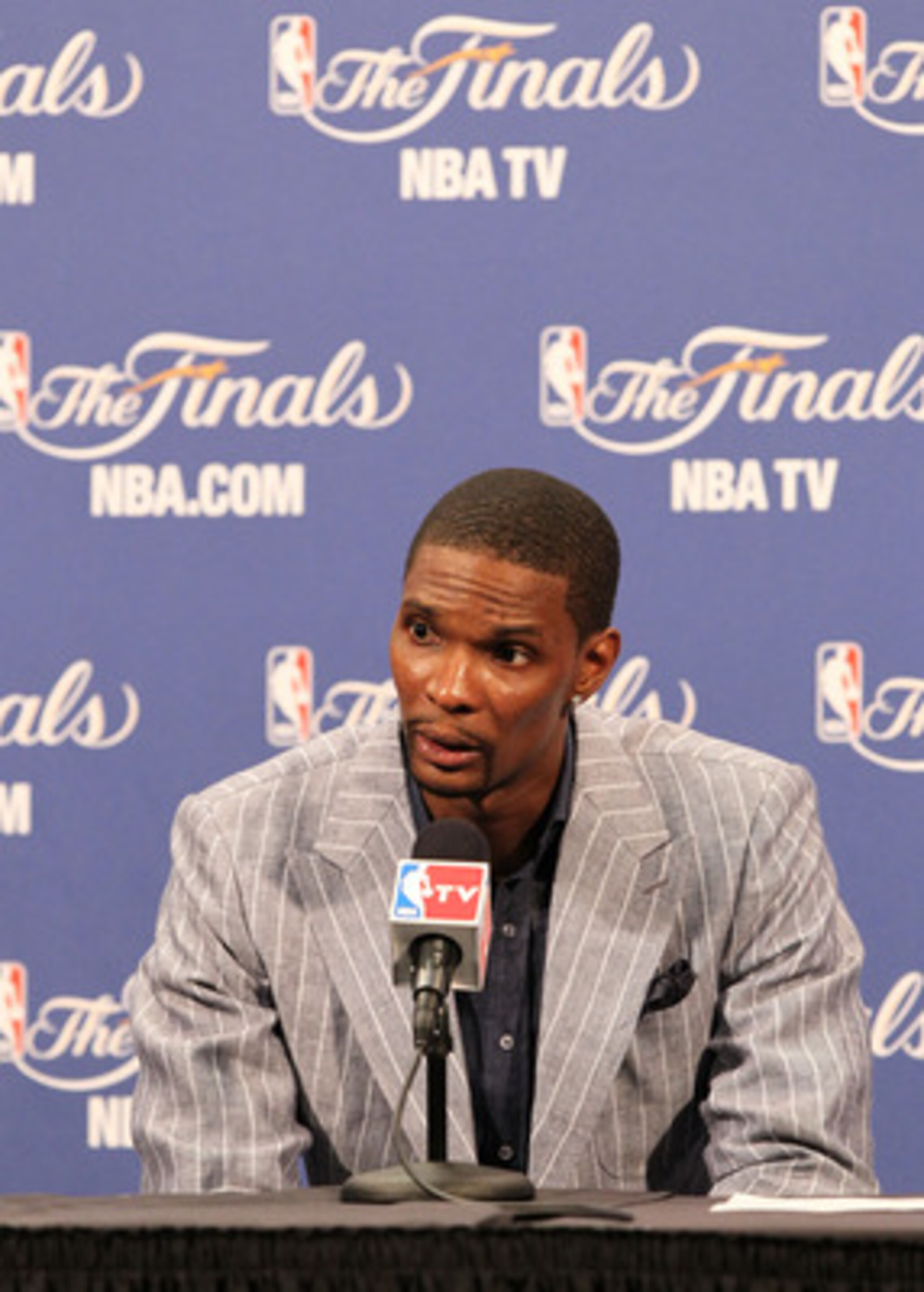 MIAMI, FL - JUNE 02:  Chris Bosh #1 of the Miami Heat answers questions from the media during a post game press conference after the Heat lost 95-93 against the Dallas Mavericks in Game Two of the 2011 NBA Finals at American Airlines Arena on June 2, 2011