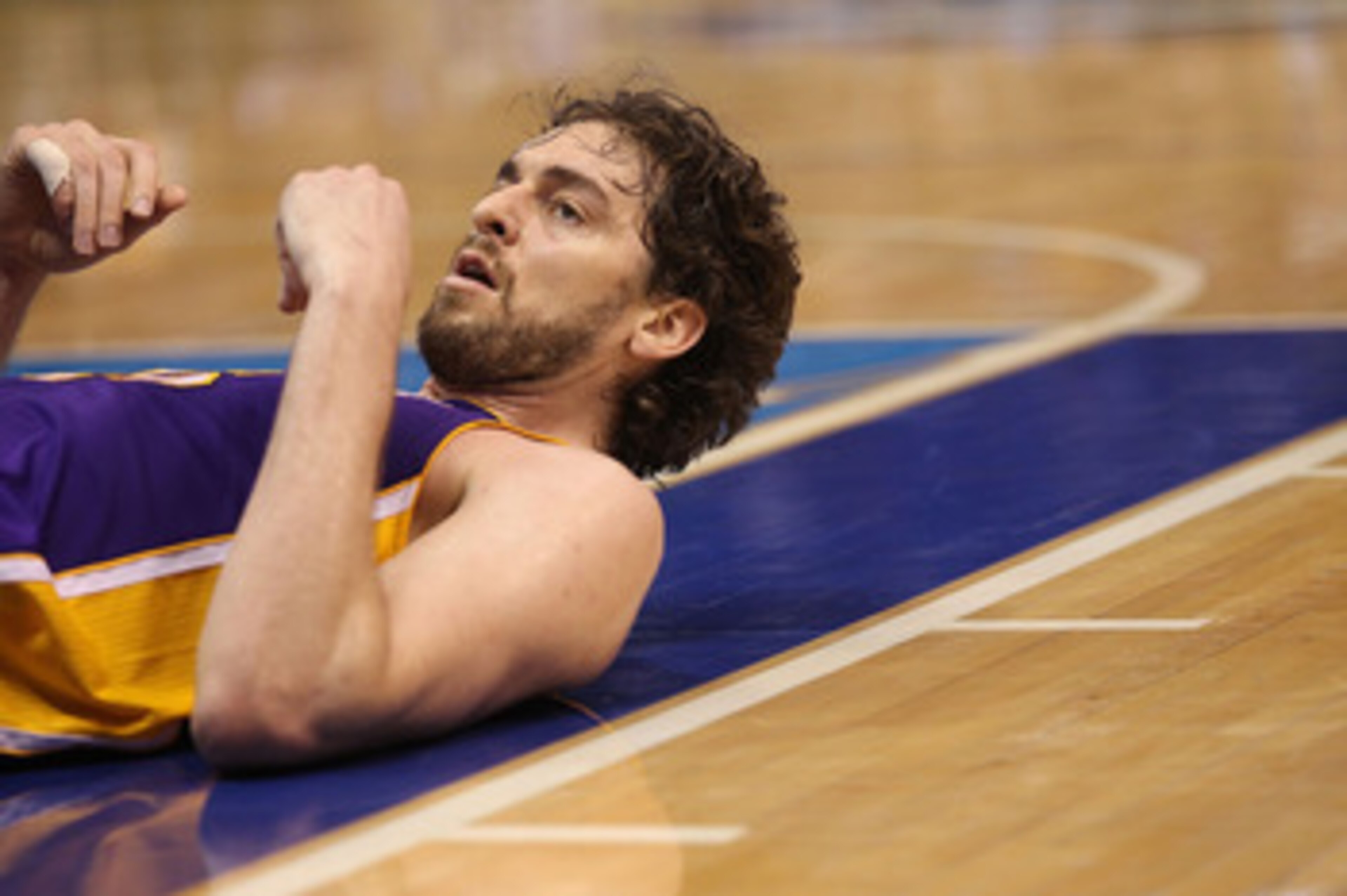 DALLAS, TX - MAY 08: Forward Pau Gasol #16 of the Los Angeles Lakers on the ground after a foul by the Dallas Mavericks in Game Four of the Western Conference Semifinals during the 2011 NBA Playoffs on May 8, 2011 at American Airlines Center in Dallas, T DALLAS, TX - MAY 08: Forward Pau Gasol #16 of the Los Angeles Lakers on the ground after a foul by the Dallas Mavericks in Game Four of the Western Conference Semifinals during the 2011 NBA Playoffs on May 8, 2011 at American Airlines Center in Dallas, T