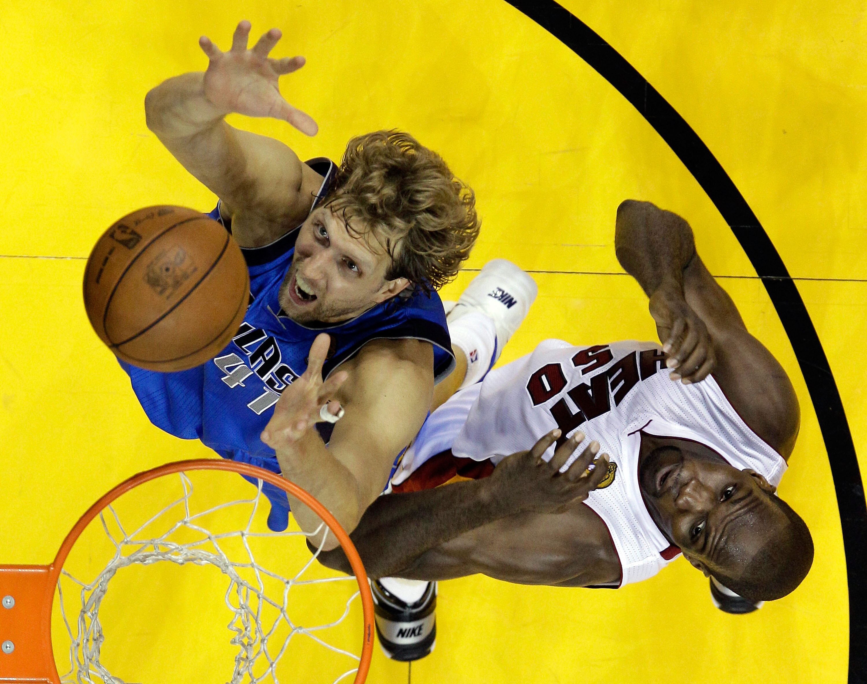 MIAMI, FL - JUNE 02:  Dirk Nowitzki #41 of the Dallas Mavericks goes up for a rebound alongside Joel Anthony #50 of the Miami Heat in the first half in Game Two of the 2011 NBA Finals at American Airlines Arena on June 2, 2011 in Miami, Florida. NOTE TO U