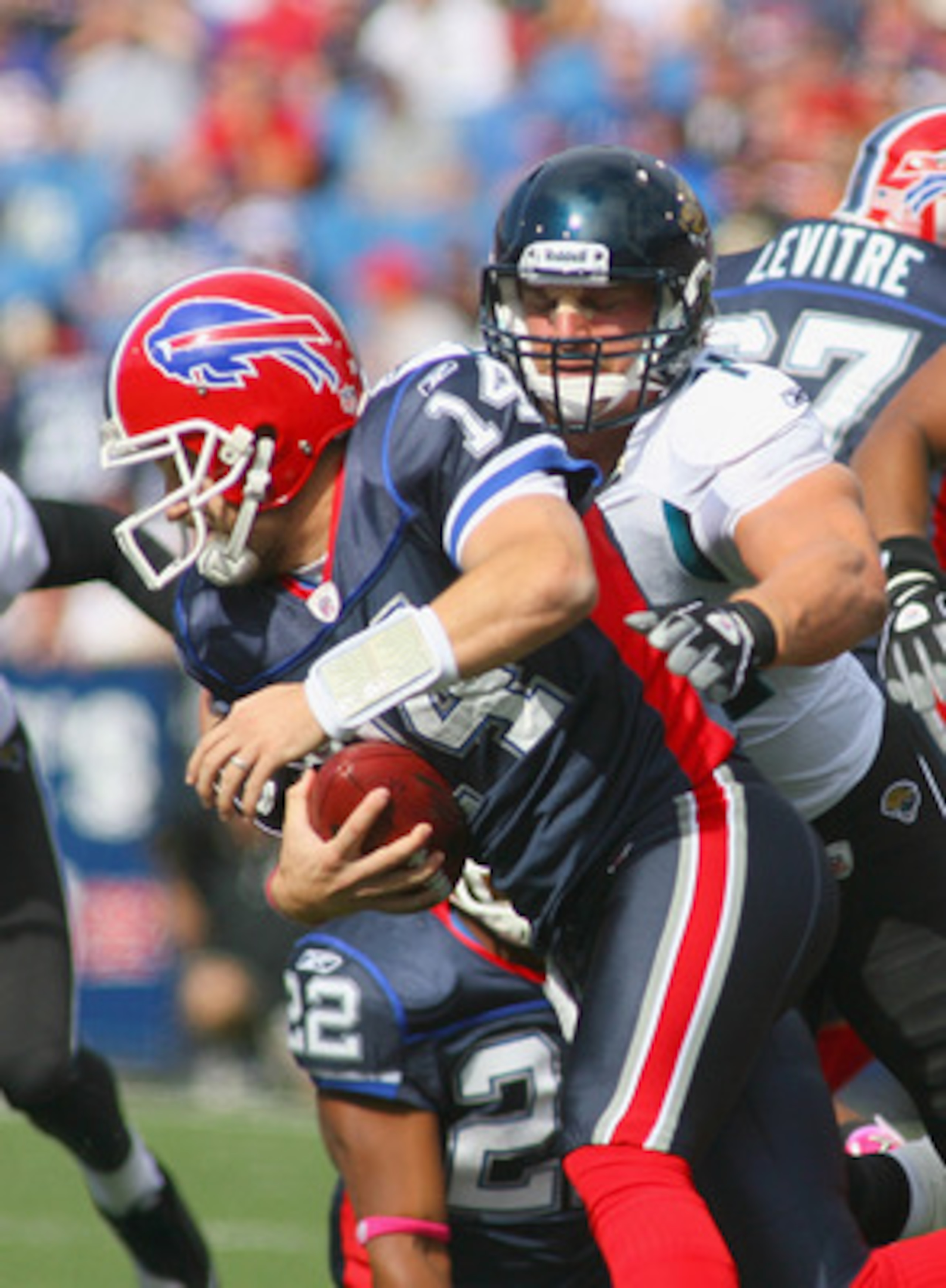 ORCHARD PARK, NY - OCTOBER 10: Ryan Fitzpatrick #14 of the Buffalo Bills is sacked by Aaron Kampman  #74 of the Jacksonville Jaguars at Ralph Wilson Stadium on October 10, 2010 in Orchard Park, New York.  (Photo by Rick Stewart/Getty Images)
