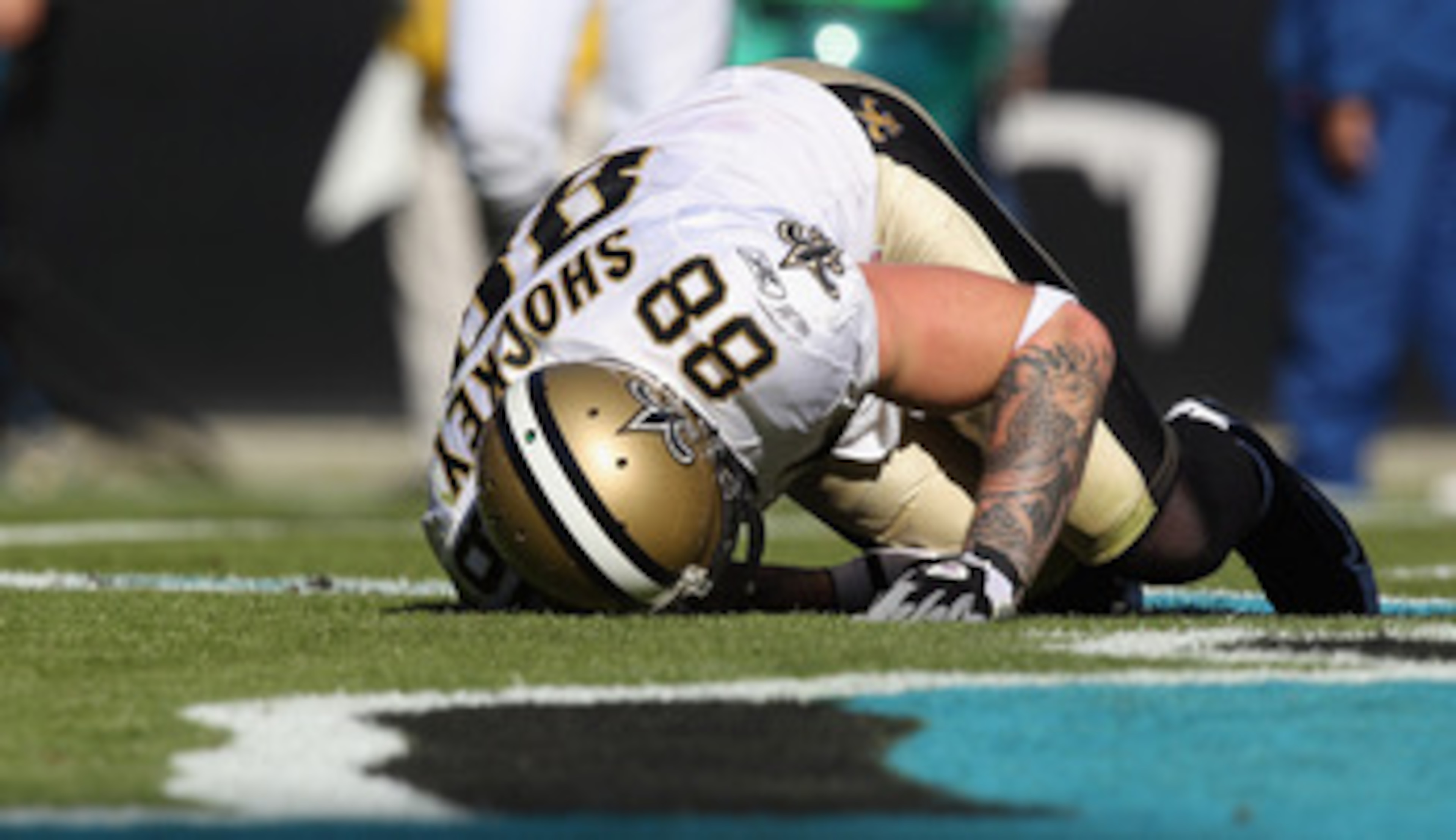 CHARLOTTE, NC - NOVEMBER 07:  Jeremy Shockey #88 of the New Orleans Saints is injured after a touchdown against the Carolina Panthers during their game at Bank of America Stadium on November 7, 2010 in Charlotte, North Carolina.  (Photo by Streeter Lecka/