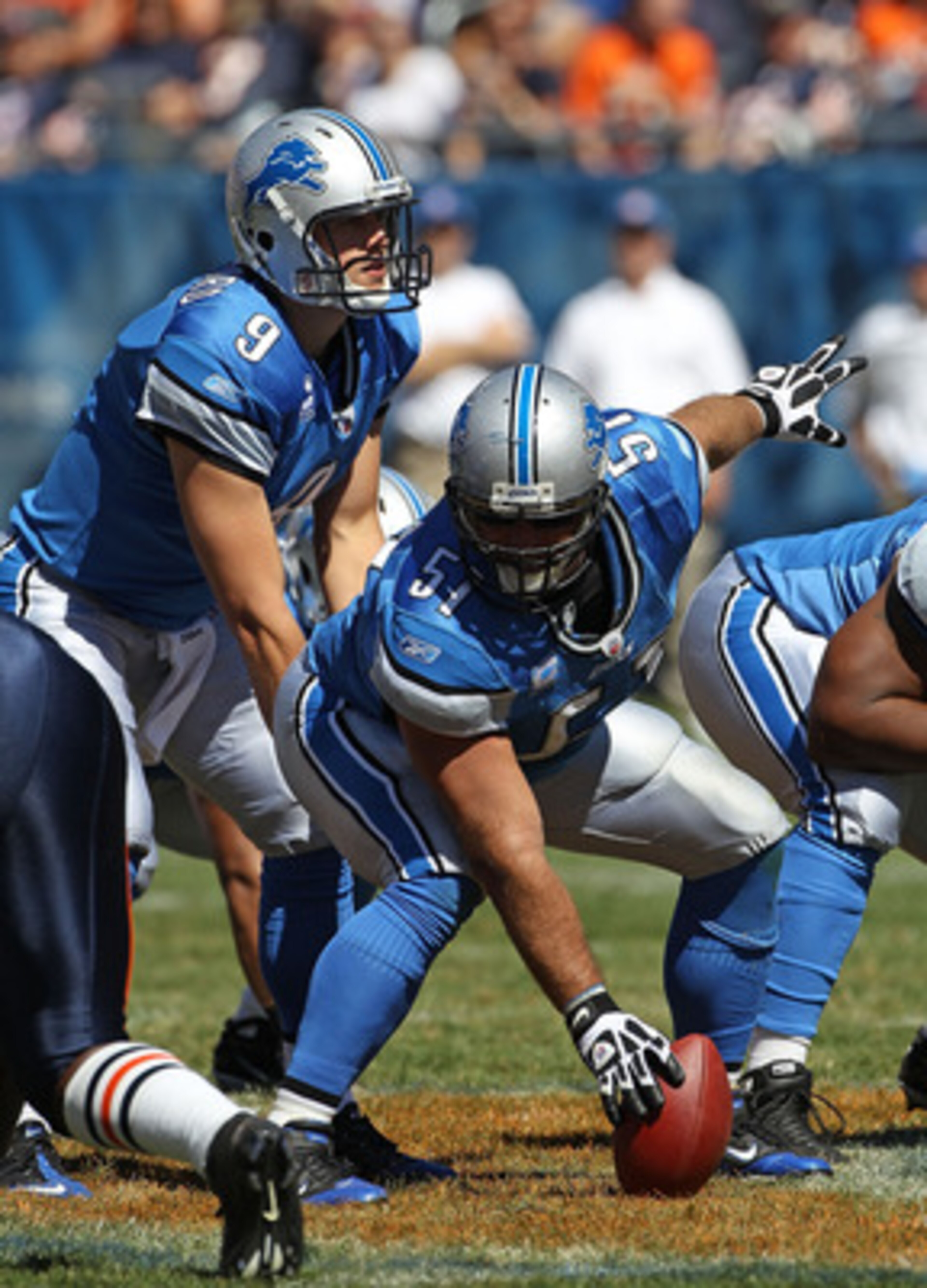CHICAGO - SEPTEMBER 12: Dominic Raiola #51 of the Detroit Lions prepares to snap the ball to Matthew Stafford #9 during the NFL season opening game against the Chicago Bears at Soldier Field on September 12, 2010 in Chicago, Illinois. The Bears defeated t