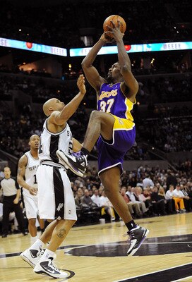 SAN ANTONIO - JANUARY 12:  Forward Ron Artest #37 of the Los Angeles Lakers takes a shot against Richard Jefferson #24 of the San Antonio Spurs on January 12, 2010 at AT&T Center in San Antonio, Texas.  NOTE TO USER: User expressly acknowledges and agrees