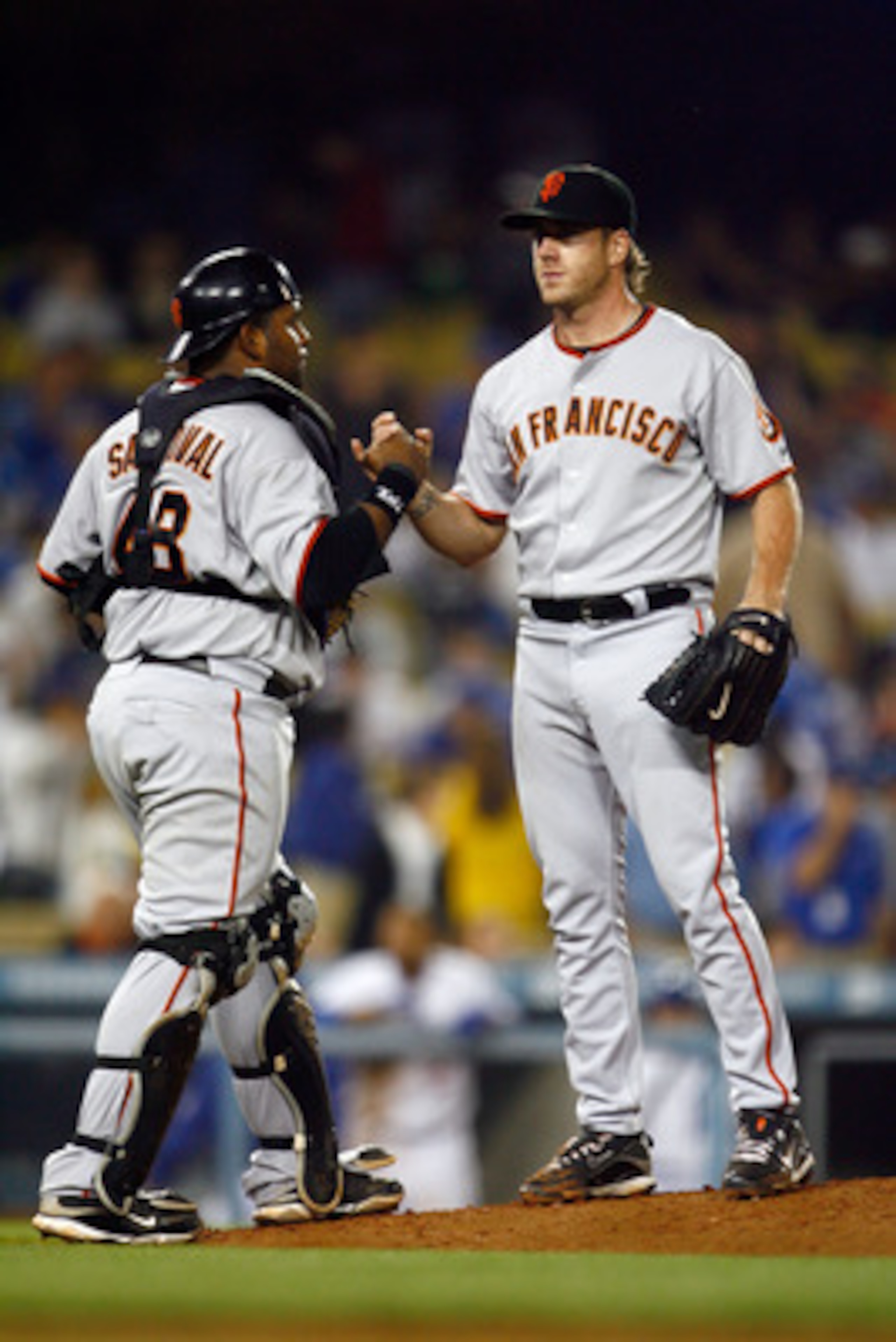 LOS ANGELES, CA - MAY 08:  Pitcher Brian Wilson (L) #38 of the San Francisco Giants is congratulated by catcher Pablo Sandoval #48 after saving the game against the Los Angeles Dodgers at Dodger Stadium on May 8, 2009 in Los Angeles, California. The Giant