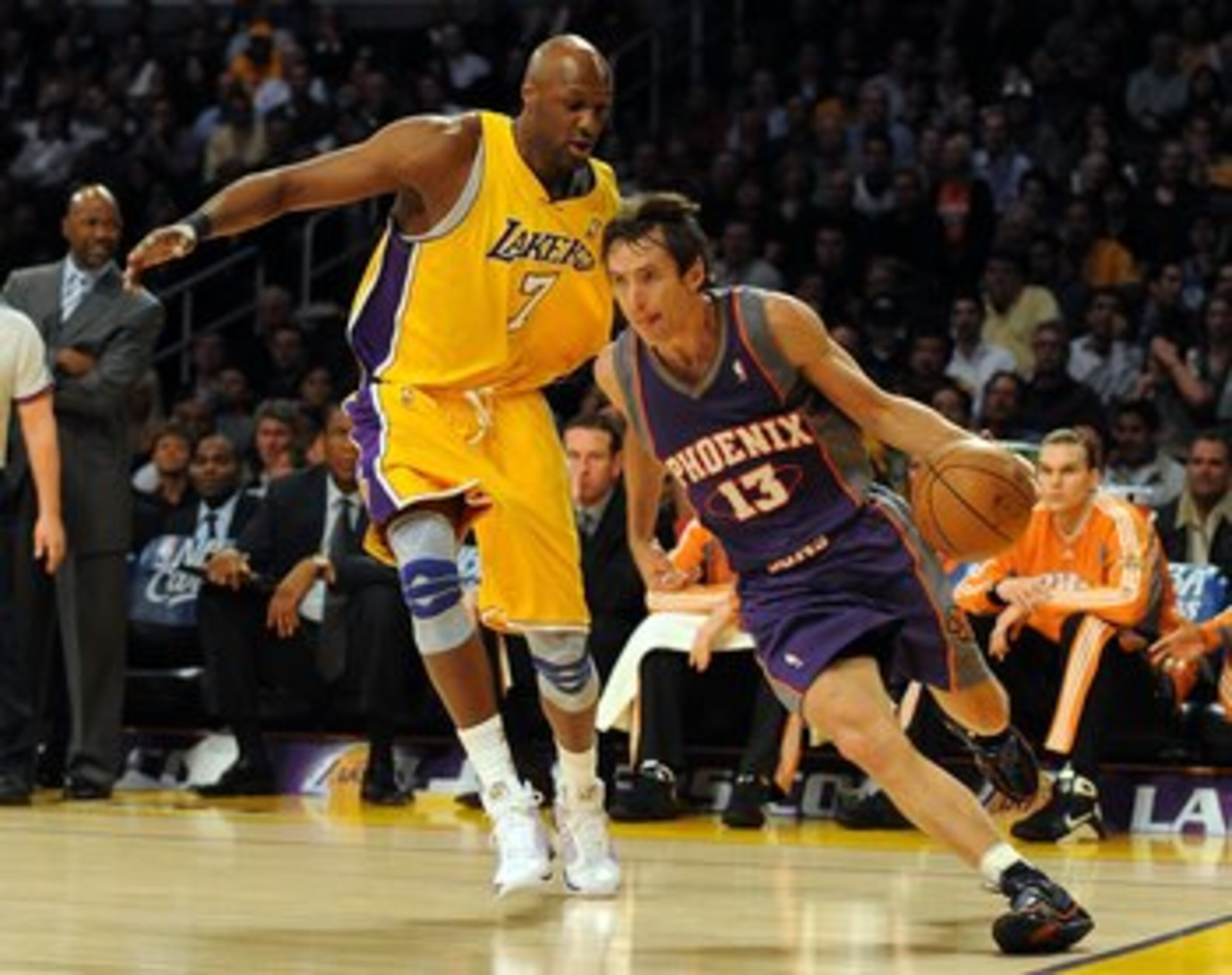 LOS ANGELES, CA - DECEMBER 10: Steve Nash #13 of the Phoenix Suns dribbles around Lamar Odom #7 of the Los Angeles Lakers during the first half at the Staples Center on December, 10 2008 in Los Angeles, California. NOTE TO USER: User expressly acknowle LOS ANGELES, CA - DECEMBER 10: Steve Nash #13 of the Phoenix Suns dribbles around Lamar Odom #7 of the Los Angeles Lakers during the first half at the Staples Center on December, 10 2008 in Los Angeles, California. NOTE TO USER: User expressly acknowle