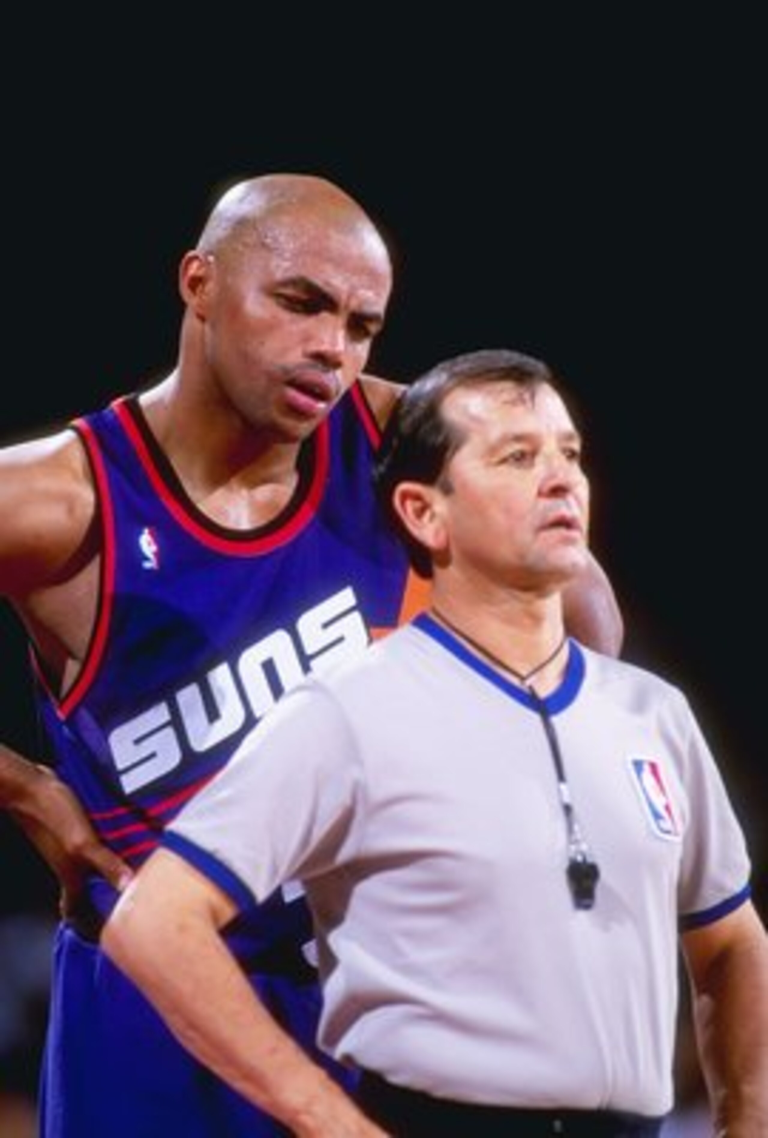 1992-1993:  Forward Charles Barkley of the Phoenix Suns confers with an official during a game against the Denver Nuggets at McNichols Arena in Denver, Colorado. Mandatory Credit: Tim DeFrisco  /Allsport