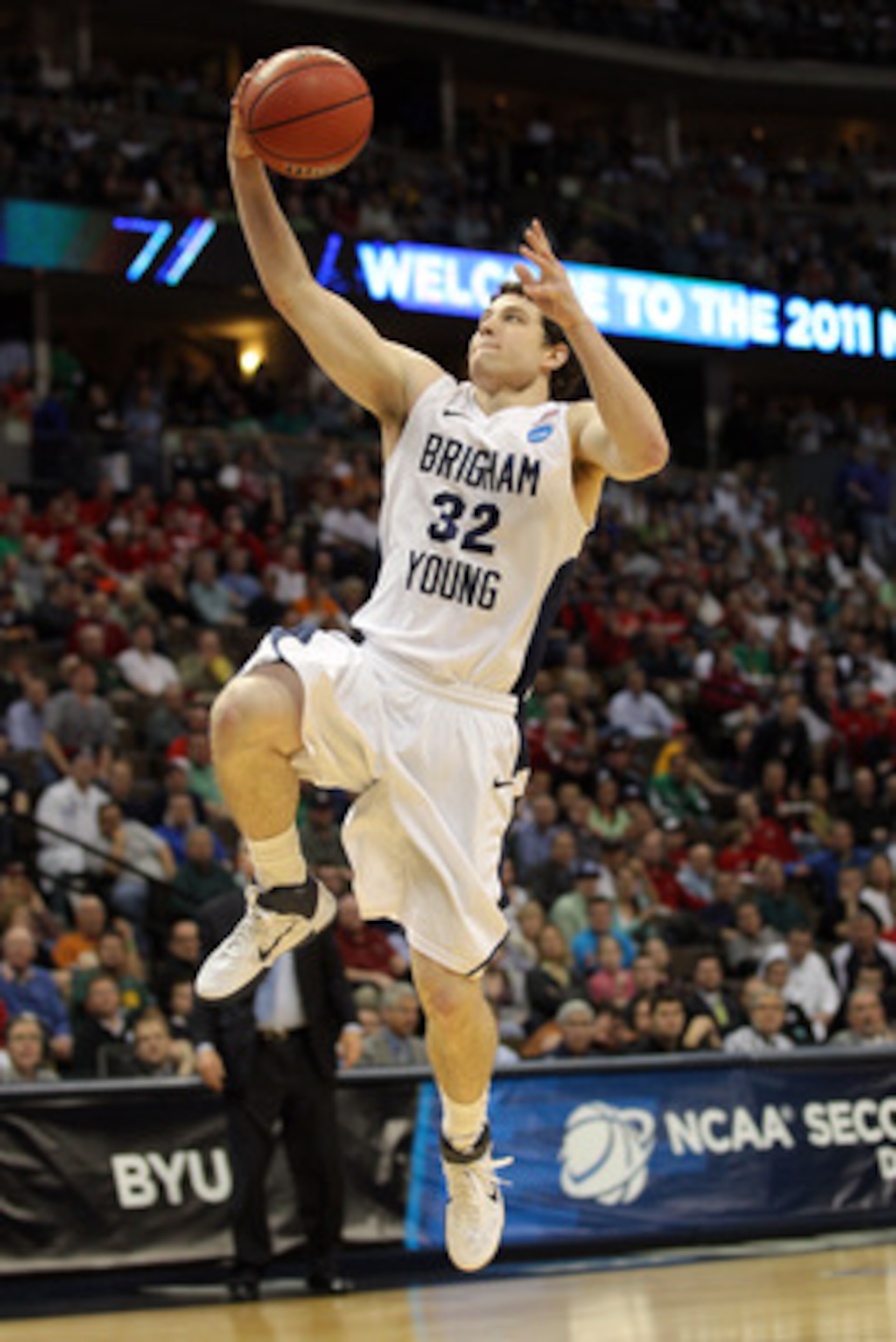 DENVER, CO - MARCH 17:  Jimmer Fredette #32 of the Brigham Young Cougars goes to the hoop for a layup against the Wofford Terriers during the second round of the 2011 NCAA men's basketball tournament at Pepsi Center on March 17, 2011 in Denver, Colorado.