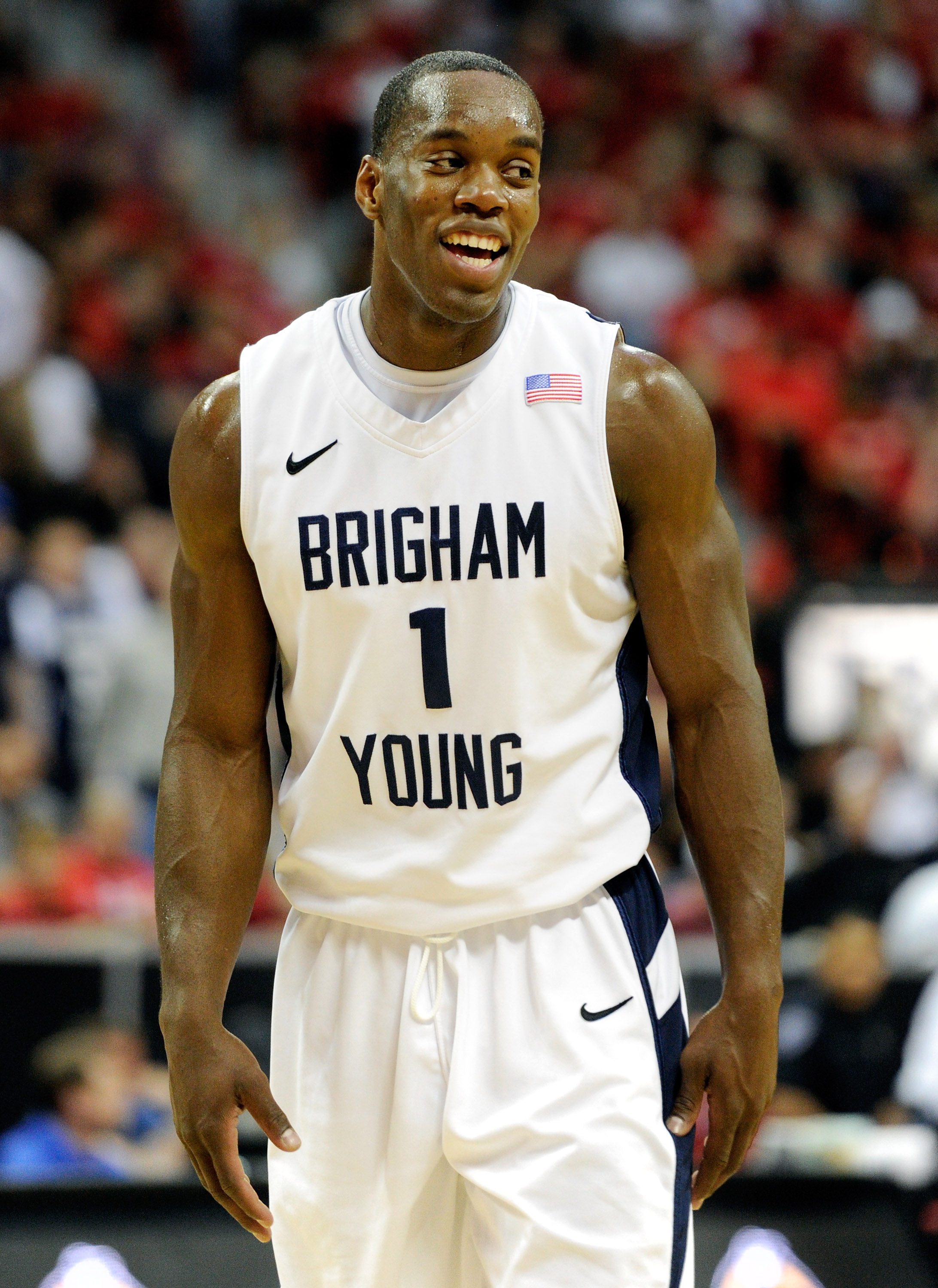 LAS VEGAS, NV - MARCH 11:  Charles Abouo #1 of the Brigham Young University Cougars smiles during a semifinal game of the Conoco Mountain West Conference Basketball tournament against the New Mexico Lobos at the Thomas & Mack Center March 11, 2011 in Las