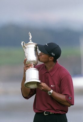 18 Jun 2000:  Tiger Woods kisses his trophy after winning the 100th US Open at the Pebble Beach Golf Links in Pebble Beach, California.Mandatory Credit: Jamie Squire  /Allsport