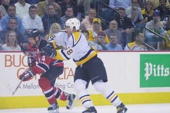 17 May2001:  Jaromir Jagr #68 of the Pittsburgh Penguins tries to block Scott Stevens #4 of the New Jersey Devils during Game 3 of the Eastern Conference  Finals at Mellon Arena in Pittsburgh, Pennsylvania .The Devils win over the Penguins 3-0, putting th