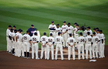 MINNEAPOLIS, MN - MAY 23: Manager Ron Gardenhire #35 of the Minnesota Twins speaks about the late Hall of Famer Harmon Killebrew while the rest of the Minnesota Twins stand around Killebrew's number in the infield dirt behind second base prior to a game a
