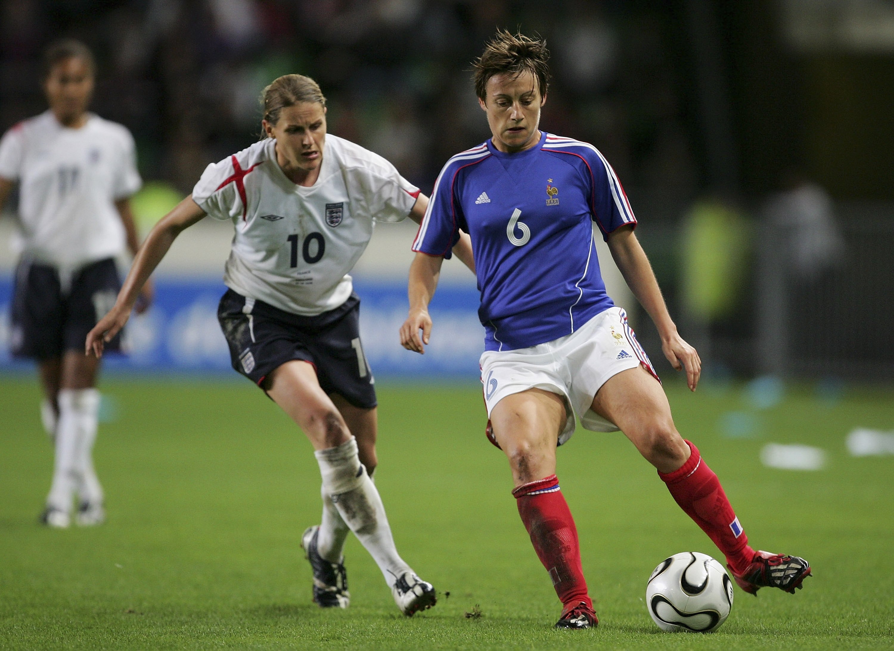 RENNES, FRANCE - SEPTEMBER 30:  Kelly Smith of England battles with Sandrine Soubeyrand of France during the FIFA Womens World Cup Qualifier match between France and England at Stade de la Route Lorient on September 30, 2006 in Rennes, France.  (Photo by