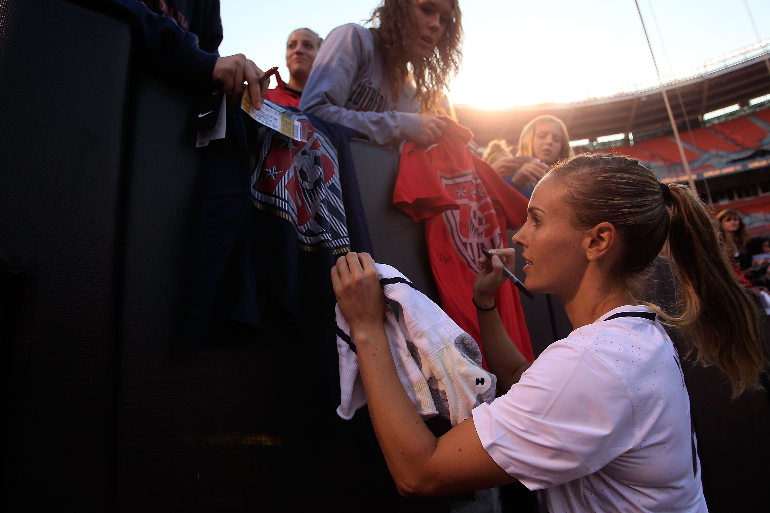 CLEVELAND - MAY 22:  Heather Mitts #2 of the United States signs autographs after their win against Germany on May 22, 2010 at Browns Stadium in Cleveland, Ohio.  (Photo by Jared Wickerham/Getty Images)