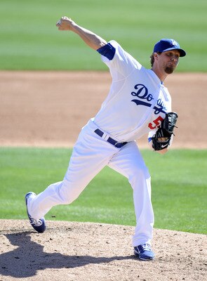 PHOENIX, AZ - FEBRUARY 28:  Matt Guerrier #55 of the Los Angeles Dodgers pitches during spring training at Camelback Ranch on February 28, 2011 in Phoenix, Arizona.  (Photo by Harry How/Getty Images)