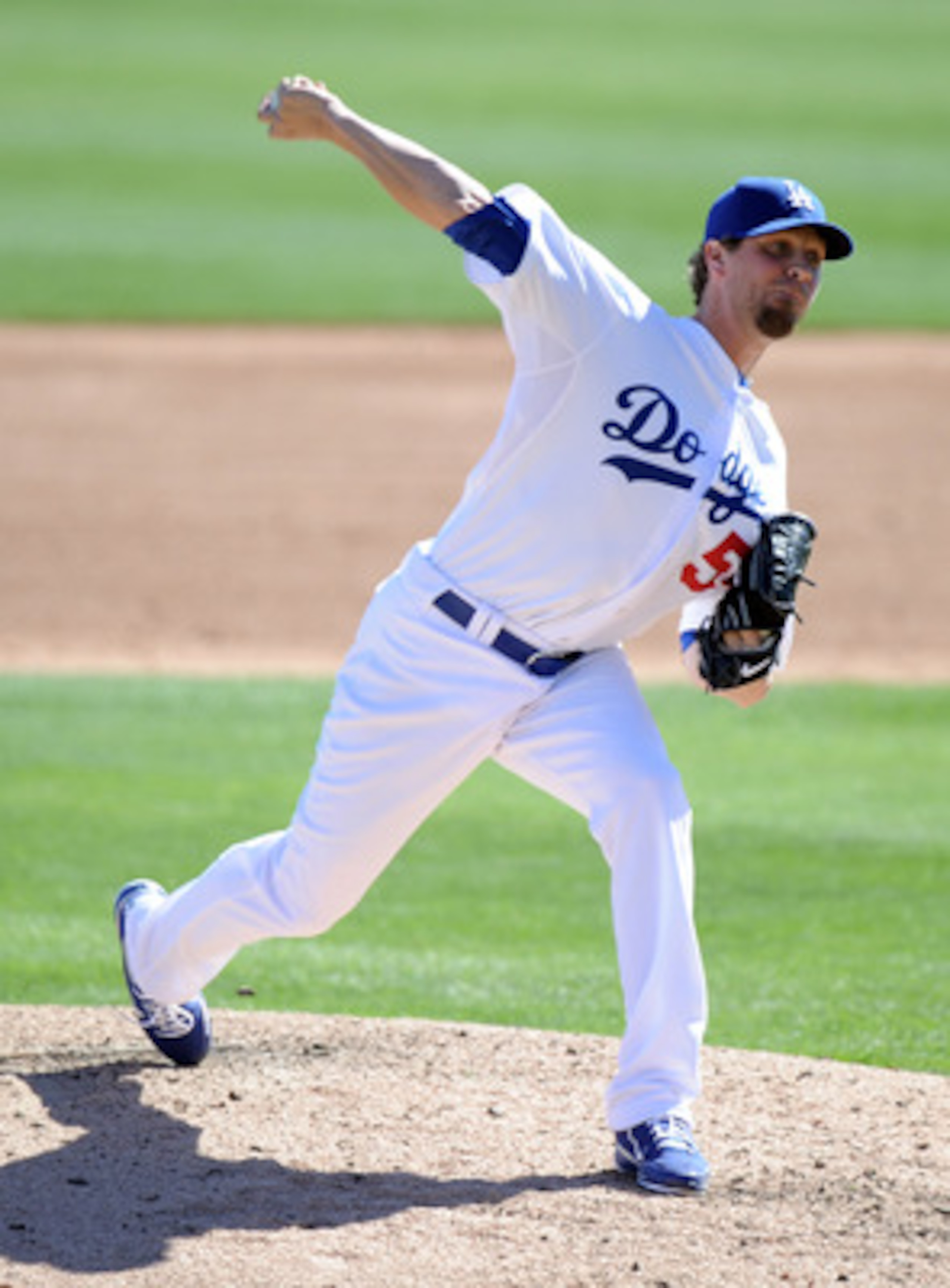 PHOENIX, AZ - FEBRUARY 28:  Matt Guerrier #55 of the Los Angeles Dodgers pitches during spring training at Camelback Ranch on February 28, 2011 in Phoenix, Arizona.  (Photo by Harry How/Getty Images)