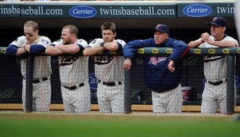 MINNEAPOLIS, MN - MAY 29: Justin Morneau #33 (L), Jason Kubel #16, Drew Butera #41, pitching coach Rick Anderson #40 and Jim Thome #25 of the Minnesota Twins during the ninth inning of their game against the Los Angeles Angels of Anaheim on May 29, 2011 a