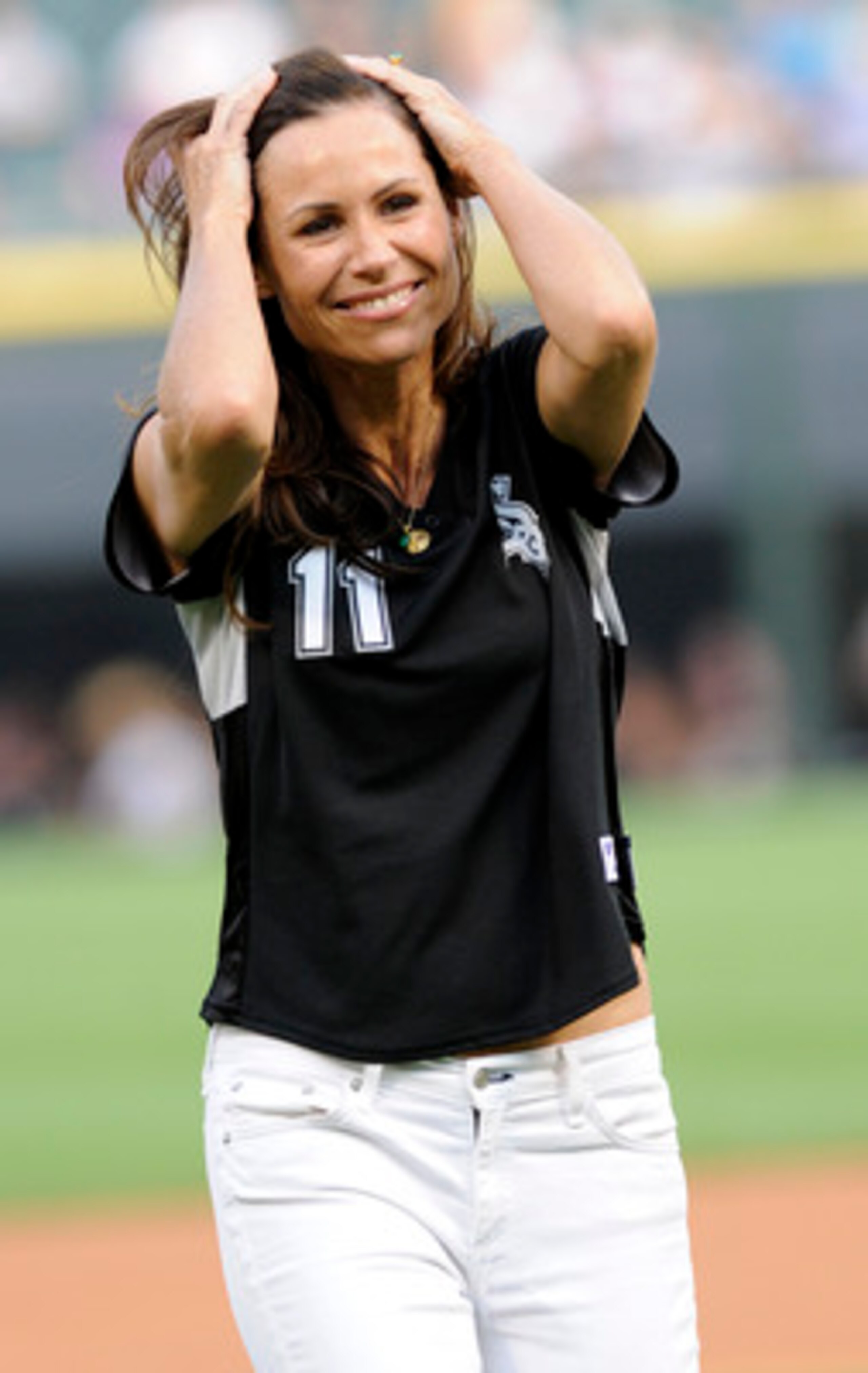 CHICAGO, IL - JUNE 03: Actress Minnie Driver reacts after throwing out the first pitch at the Chicago White Sox Detroit Tigers baseball game on June 3, 2011 at U.S. Cellular Field in Chicago, Illinois.  (Photo by David Banks/Getty Images)