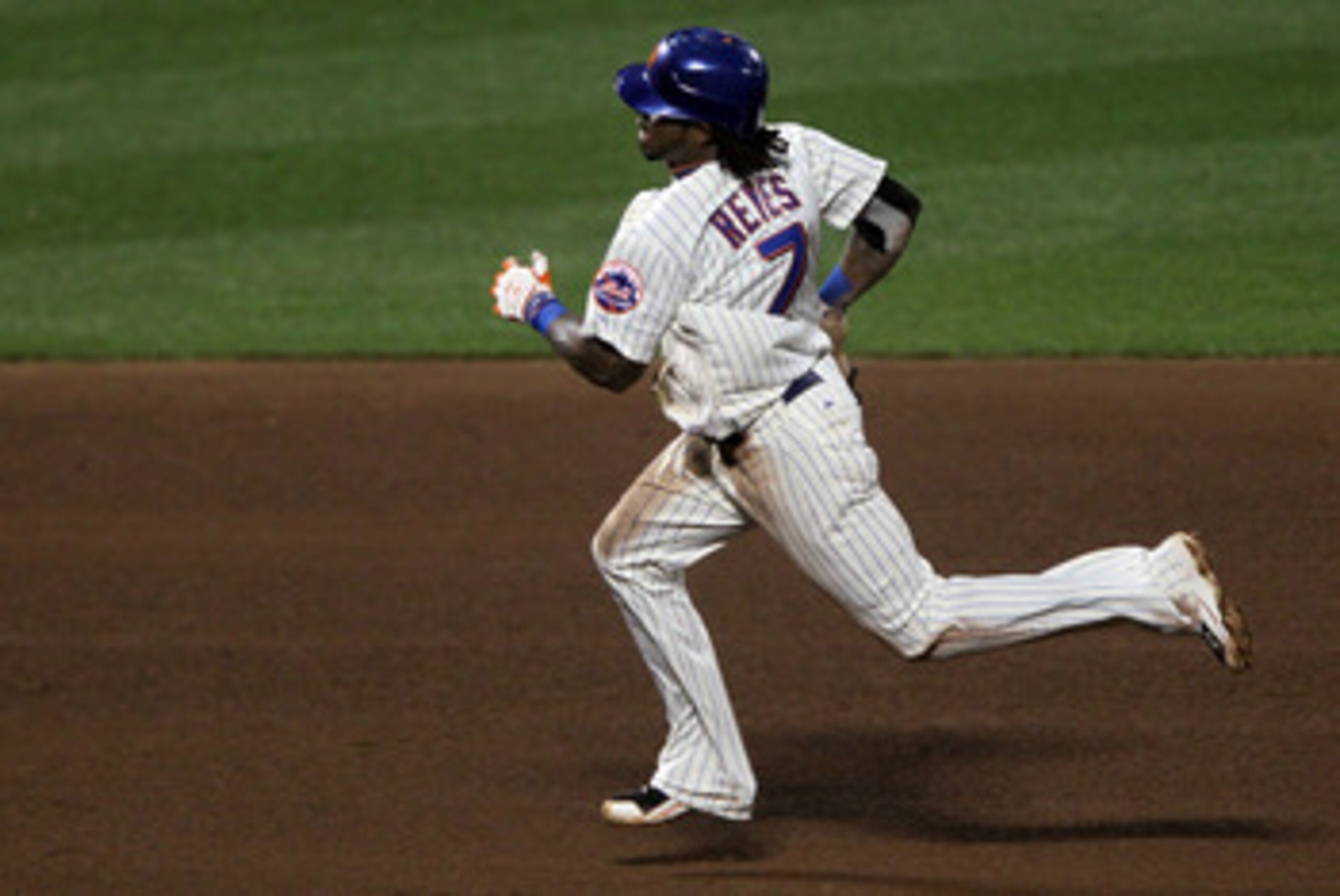 NEW YORK - AUGUST 14:  Jose Reyes #7 of the New York Mets runs the bases after during his triple against the Philadelphia Phillies on August 14, 2010 at Citi Field in the Flushing neighborhood of the Queens borough of New York City.  (Photo by Jim McIsaac