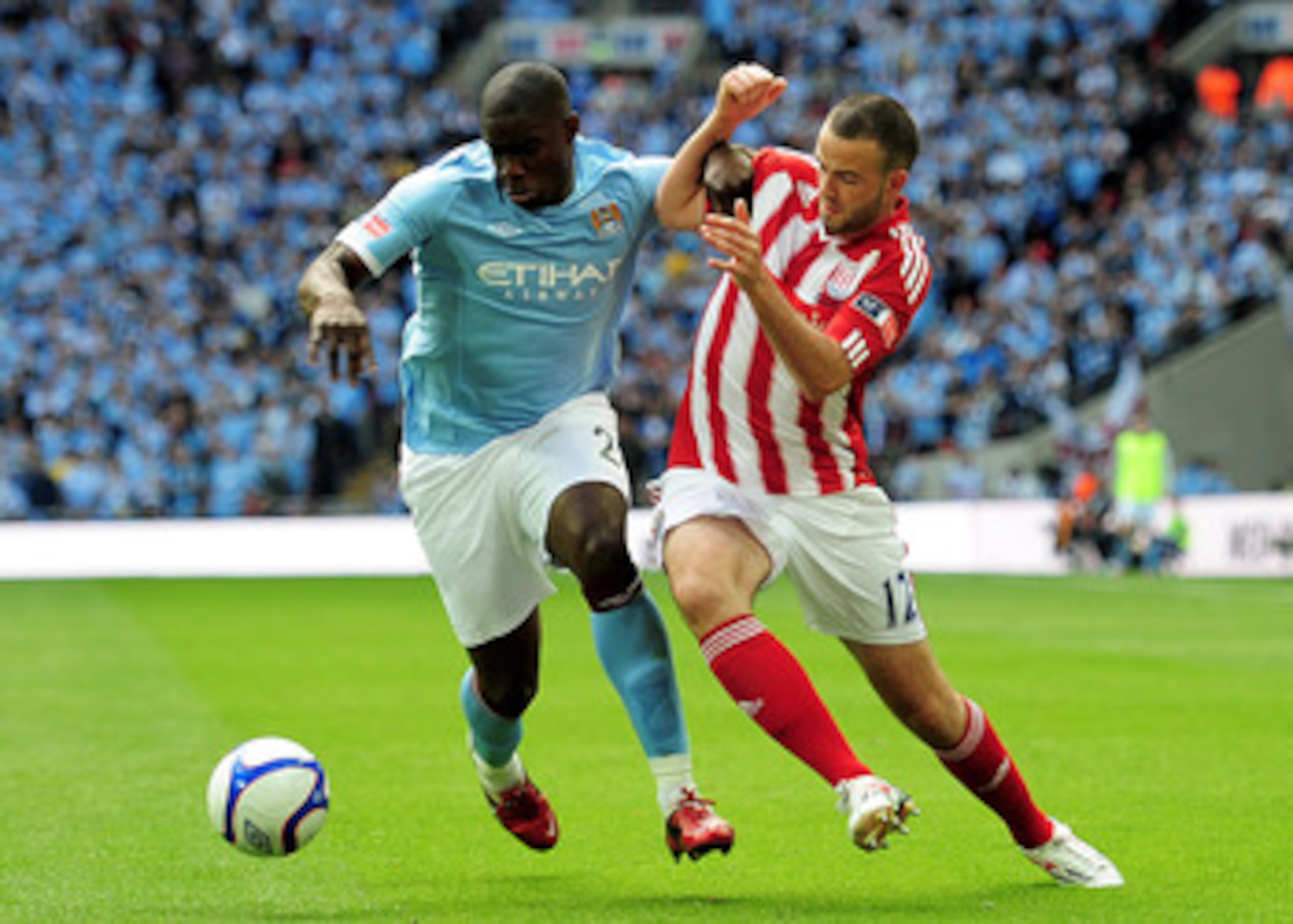 LONDON, ENGLAND - MAY 14: Micah Richards (L) of Manchester City holds off Marc Wilson (R) of Stoke City during the FA Cup sponsored by E.ON Final match between Manchester City and Stoke City at Wembley Stadium on May 14, 2011 in London, England. (Photo by
