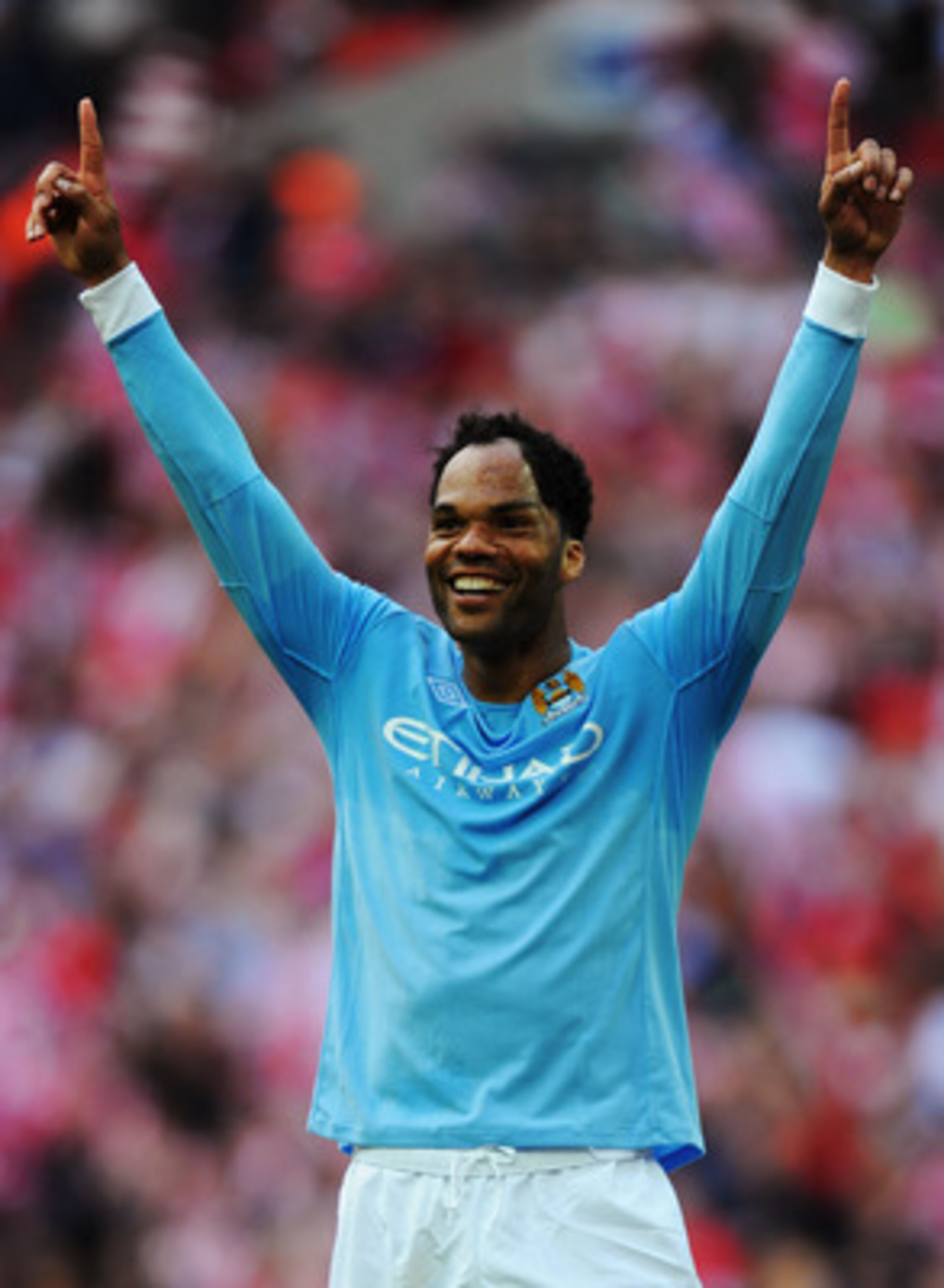 LONDON, ENGLAND - MAY 14:  Joleon Lescott of Manchester City celebrates at the final whistle as his team win the FA Cup sponsored by E.ON Final match between Manchester City and Stoke City at Wembley Stadium on May 14, 2011 in London, England.  (Photo by 