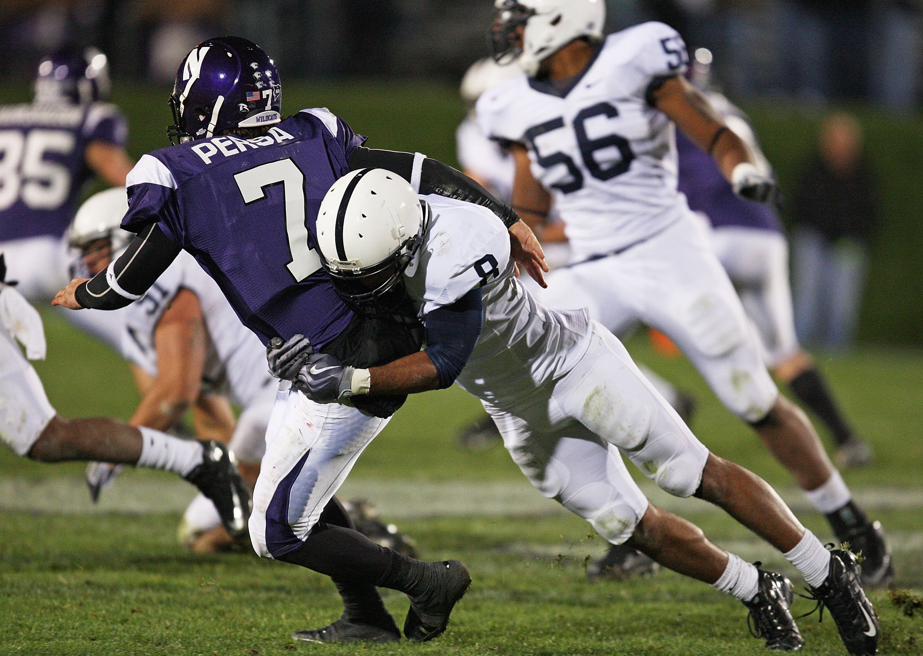 EVANSTON, IL - OCTOBER 31: Dan Persa #7 of the Northwestern Wildcats is hit by D'Anton Lynn #8 of the Penn State Nittany Lions at Ryan Field on October 31, 2009 in Evanston, Illinois. Penn State defeated Northwestern 34-13. (Photo by Jonathan Daniel/Getty