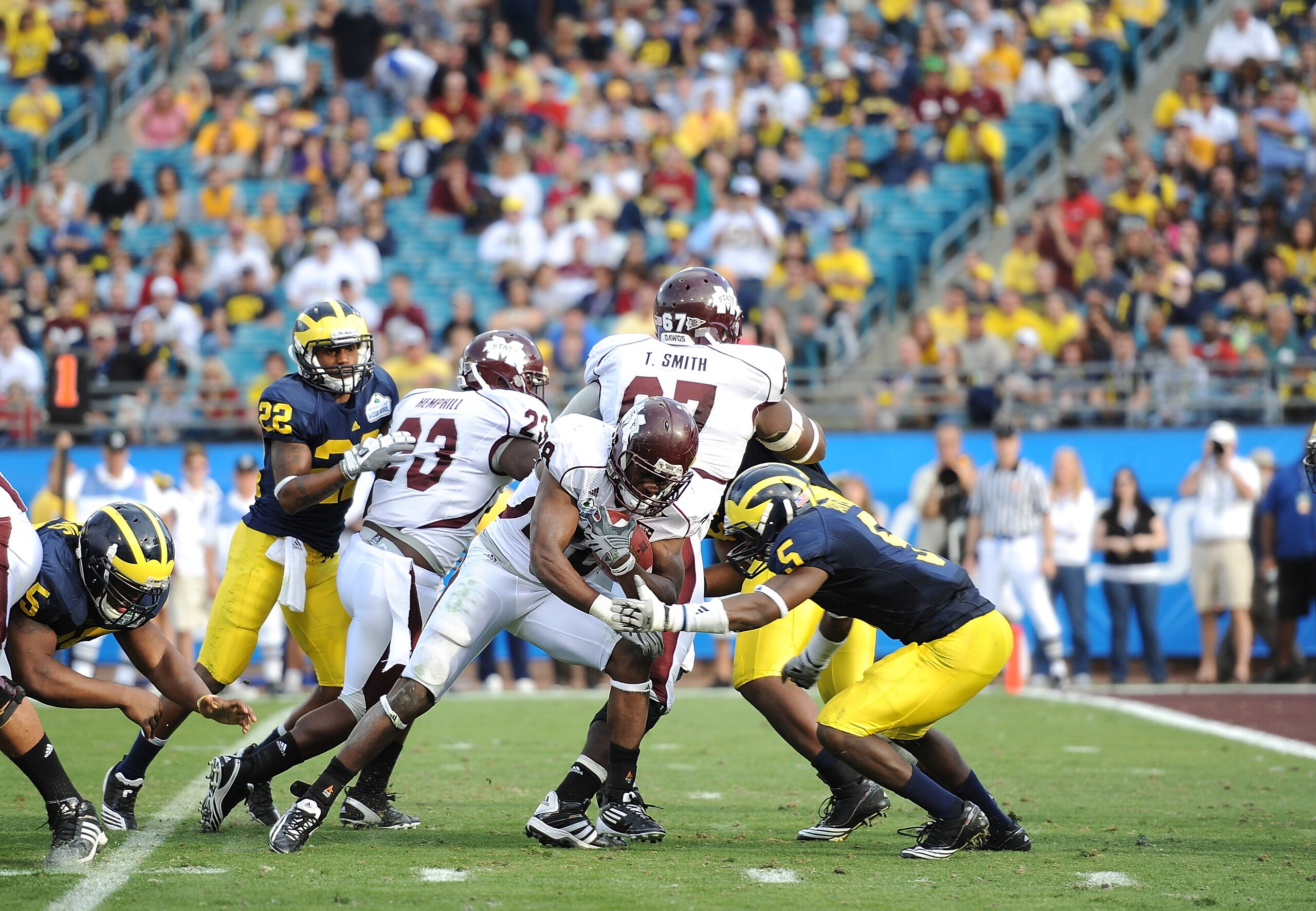 JACKSONVILLE, FL - JANUARY 01:  Running back Vick Ballard #28 of the Mississippi State Bulldogs rushes for a touchdown in the 3rd quarter against the Michigan Wolverines during the Gator Bowl at EverBank Field on January 1, 2011 in Jacksonville, Florida
