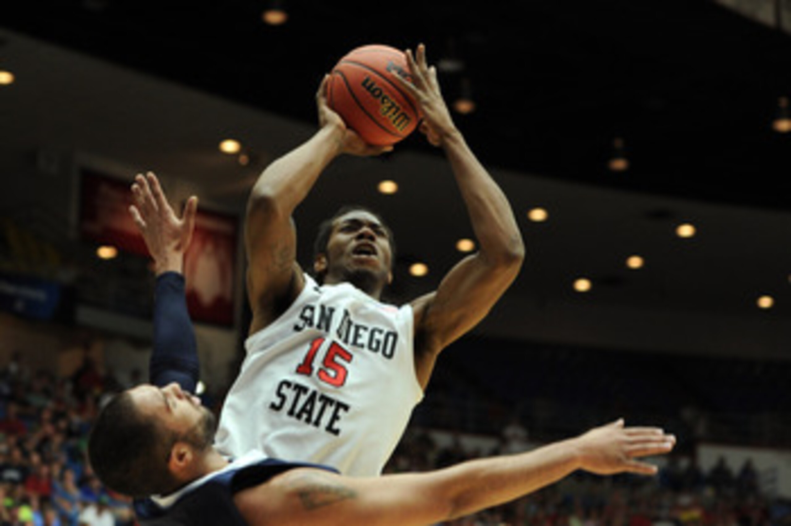 TUCSON, AZ - MARCH 17:  Kawhi Leonard #15 of the San Diego State Aztecs shoots over Taylor Montgomery #44 of the Northern Colorado Bears during the second round of the 2011 NCAA men's basketball tournament at McKale Center on March 17, 2011 in Tucson, Ari