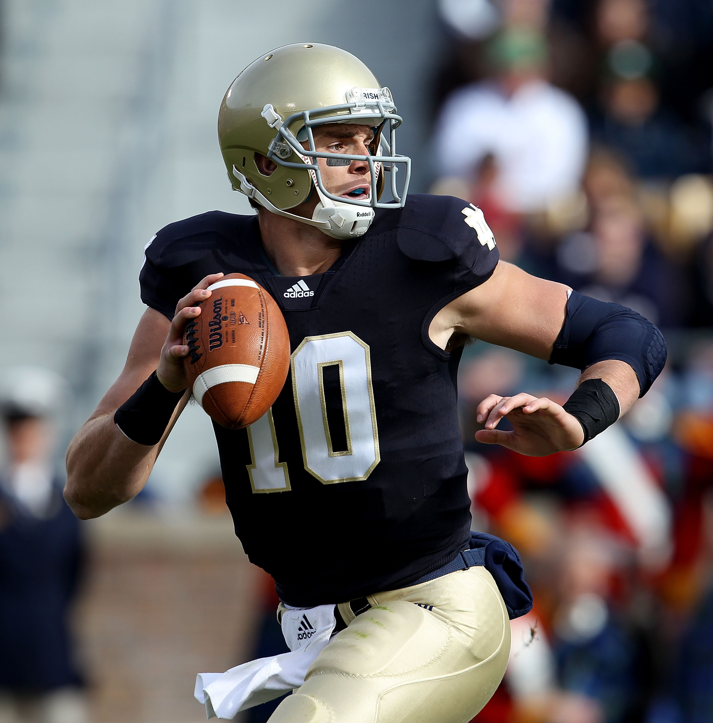 SOUTH BEND, IN - OCTOBER 30: Dayne Crist #10 of the Notre Dame Fighting Irish looks for a receiver against the Tulsa Golden Hurricane at Notre Dame Stadium on October 30, 2010 in South Bend, Indiana. Tulsa defeated Notre Dame 28-27. (Photo by Jonathan Dan