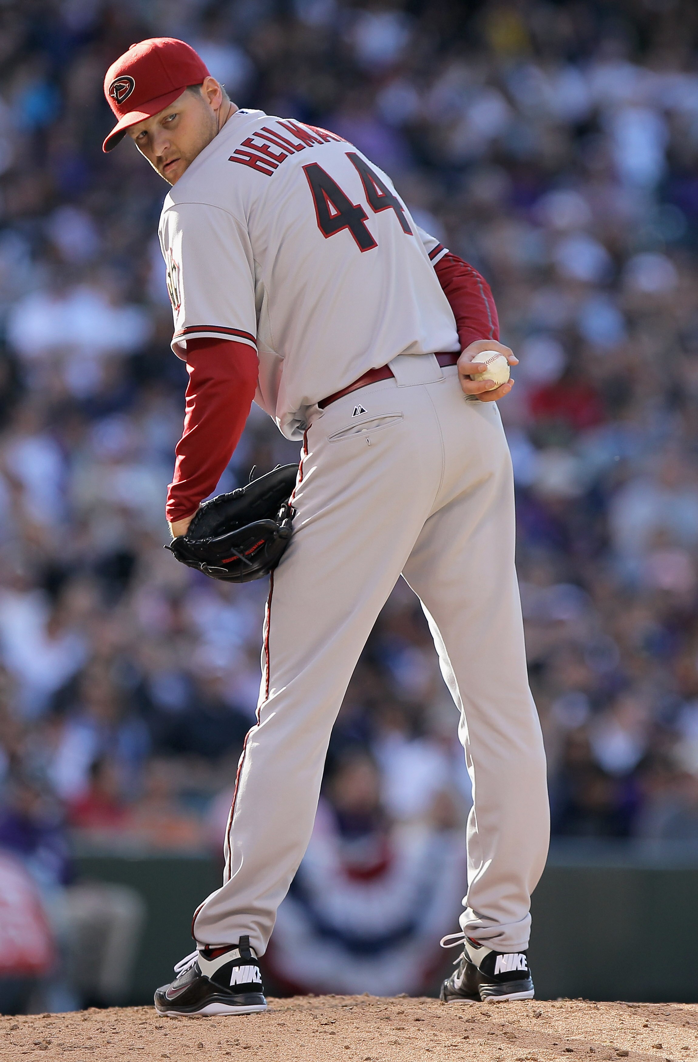 DENVER, CO - APRIL 01:  Relief pitcher Aaron Heilman #44 of the Arizona Diamondbacks works against the Colorado Rockies during Opening Day at Coors Field on April 1, 2011 in Denver, Colorado. The Diamondbacks defeated the Rockies 7-6 in 11 innings.  (Phot