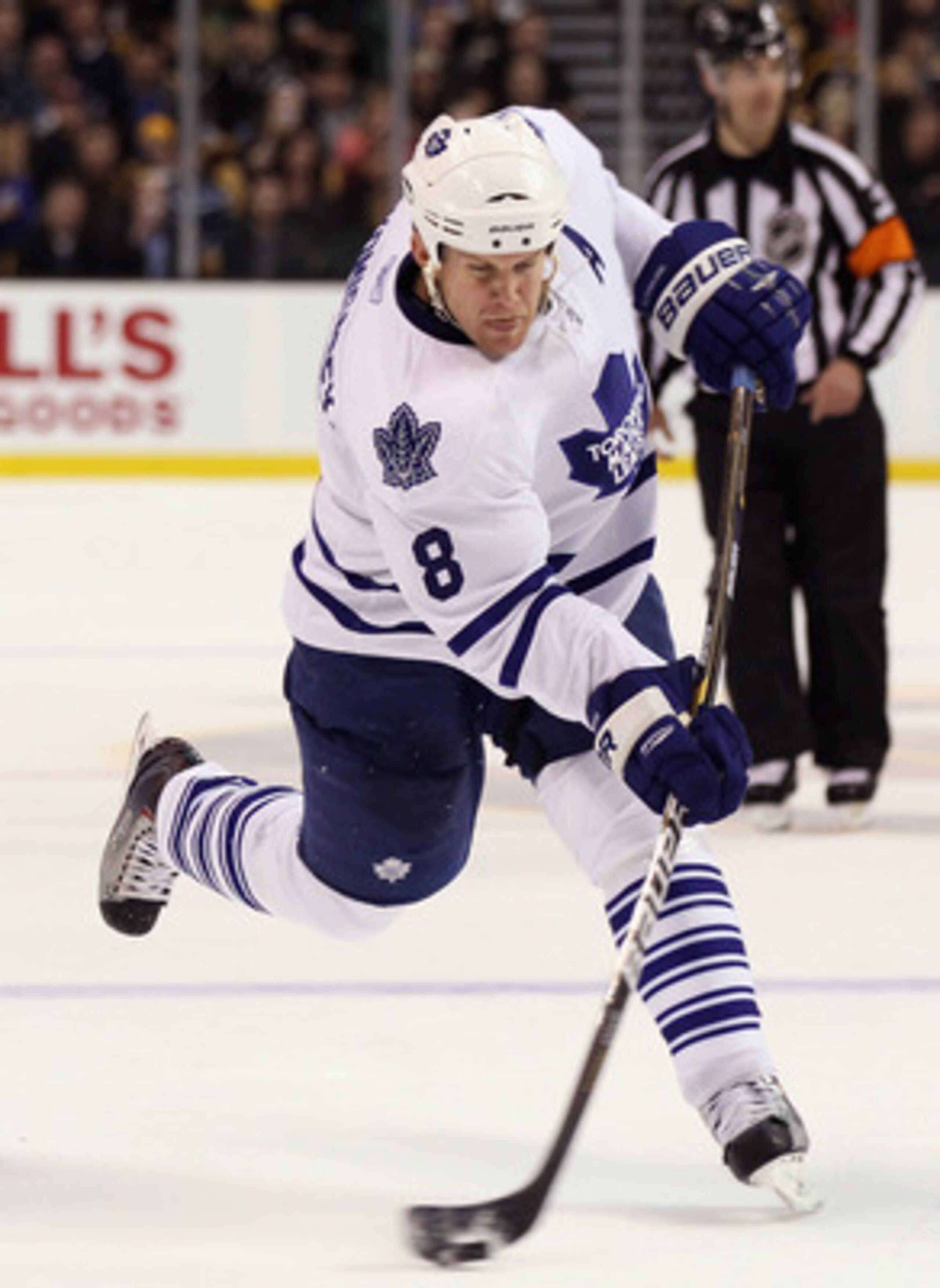 BOSTON, MA - MARCH 31:  Mike Komisarek #8 of the Toronto Maple Leafs takes a shot in the second period against the Boston Bruins on March 31, 2011 at the TD Garden in Boston, Massachusetts.  (Photo by Elsa/Getty Images)
