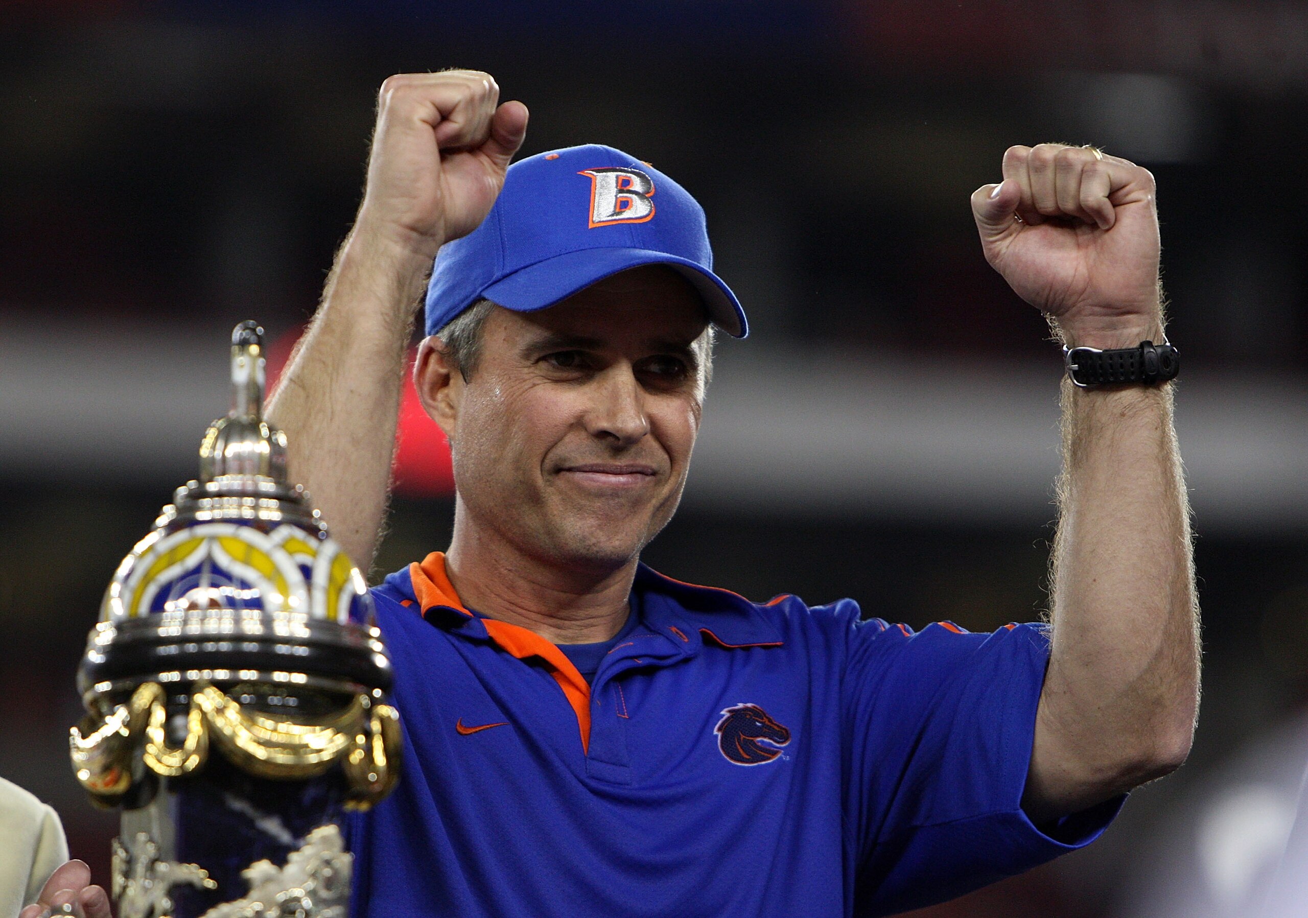 GLENDALE, AZ - JANUARY 04:  Head coach Chris Petersen of the Boise State Broncos celebrates after defeating the TCU Horned Frogs 17-10 during the Tostitos Fiesta Bowl at the Universtity of Phoenix Stadium on January 4, 2010 in Glendale, Arizona.  (Photo b
