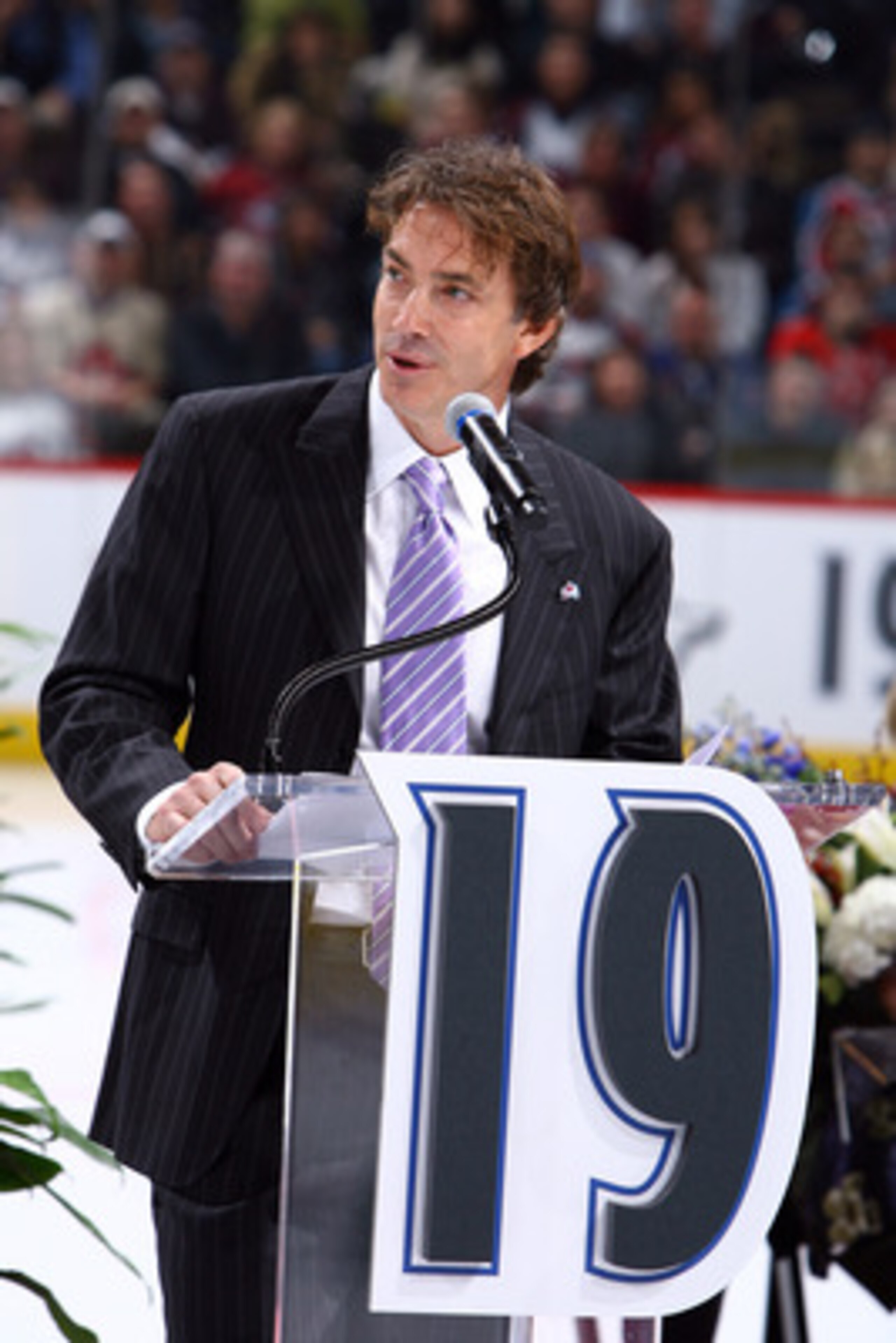 DENVER - OCTOBER 1: Joe Sakic addresses the crowd as his number is retired by the Colorado Avalanche and hoisted to the rafters in a pregame ceremony at the Pepsi Center on October 1, 2009 in Denver, Colorado. NOTE TO USER: User expressly acknowledges and