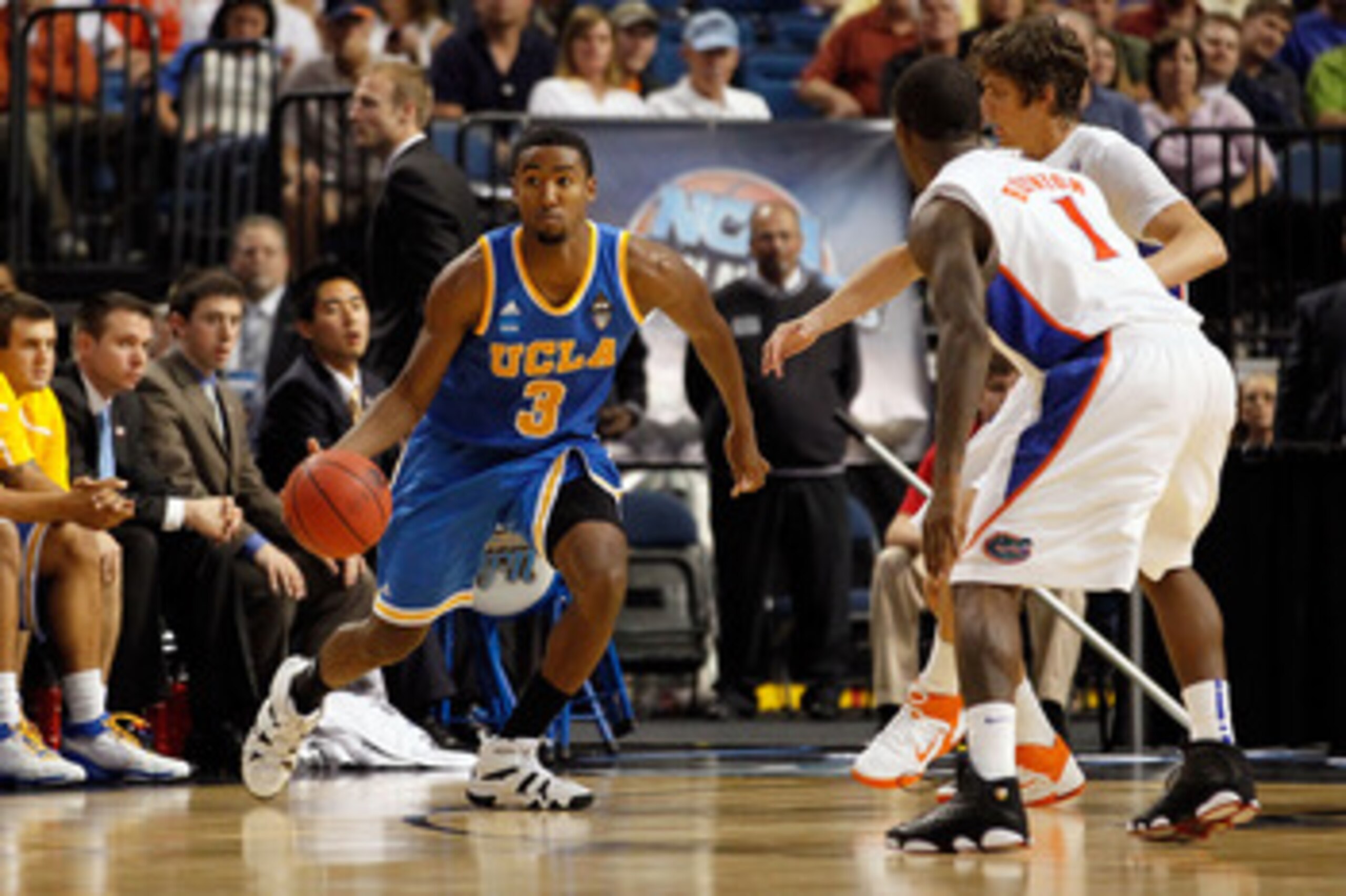 TAMPA, FL - MARCH 19:  Malcolm Lee #3 of the UCLA Bruins drives against the Florida Gators during the third round of the 2011 NCAA men's basketball tournament at St. Pete Times Forum on March 19, 2011 in Tampa, Florida. Florida won 73-65. (Photo by J. Mer