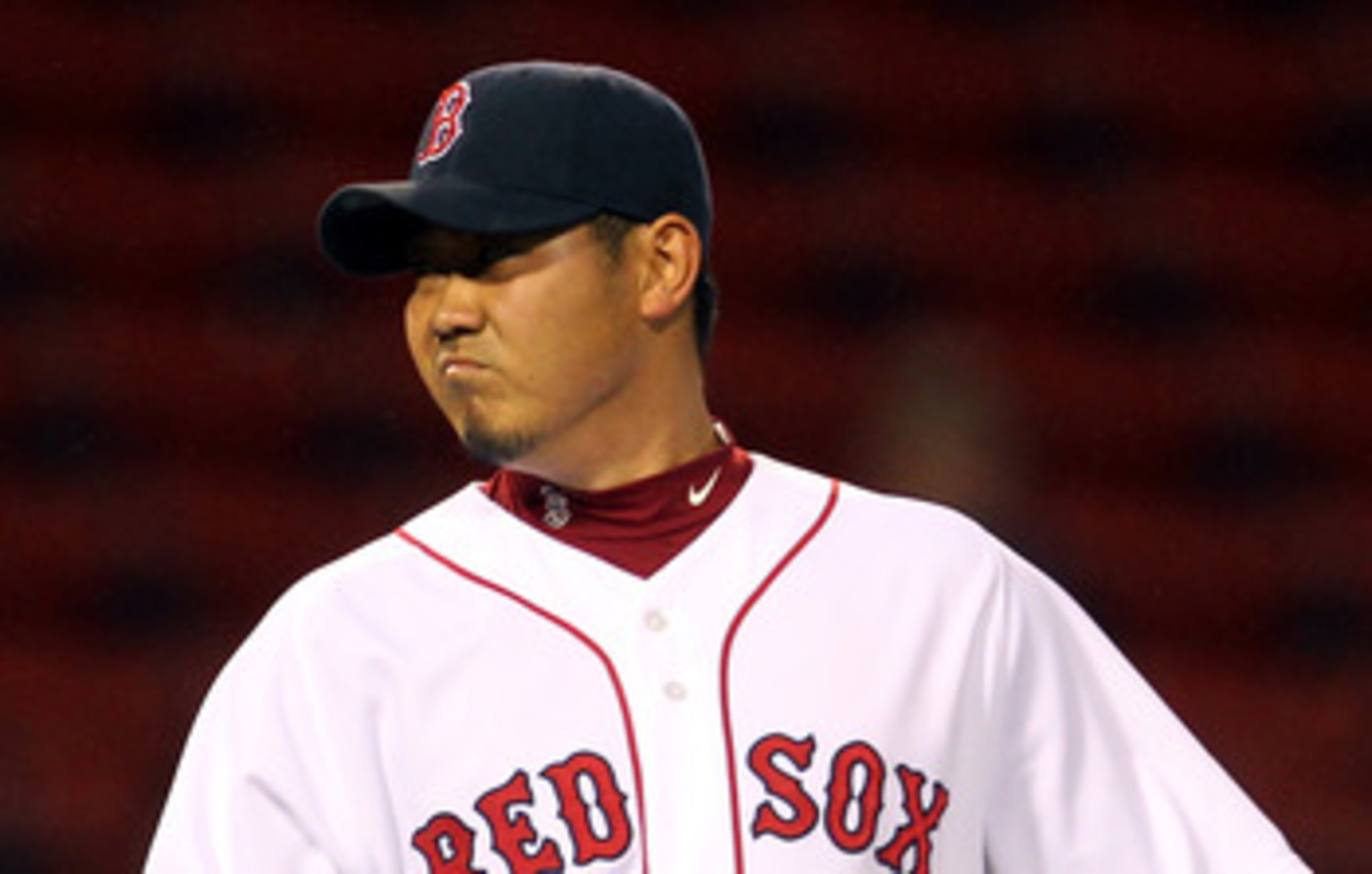 BOSTON, MA - MAY 04:  Daisuke Matsuzaka #18 of the Boston Red Sox reacts after giving up a single to Peter Bourjos #25 of the Los Angeles Angels of Anaheim in the 13th inning at Fenway Park on May 4, 2011 in Boston, Massachusetts. (Photo by Jim Rogash/Get