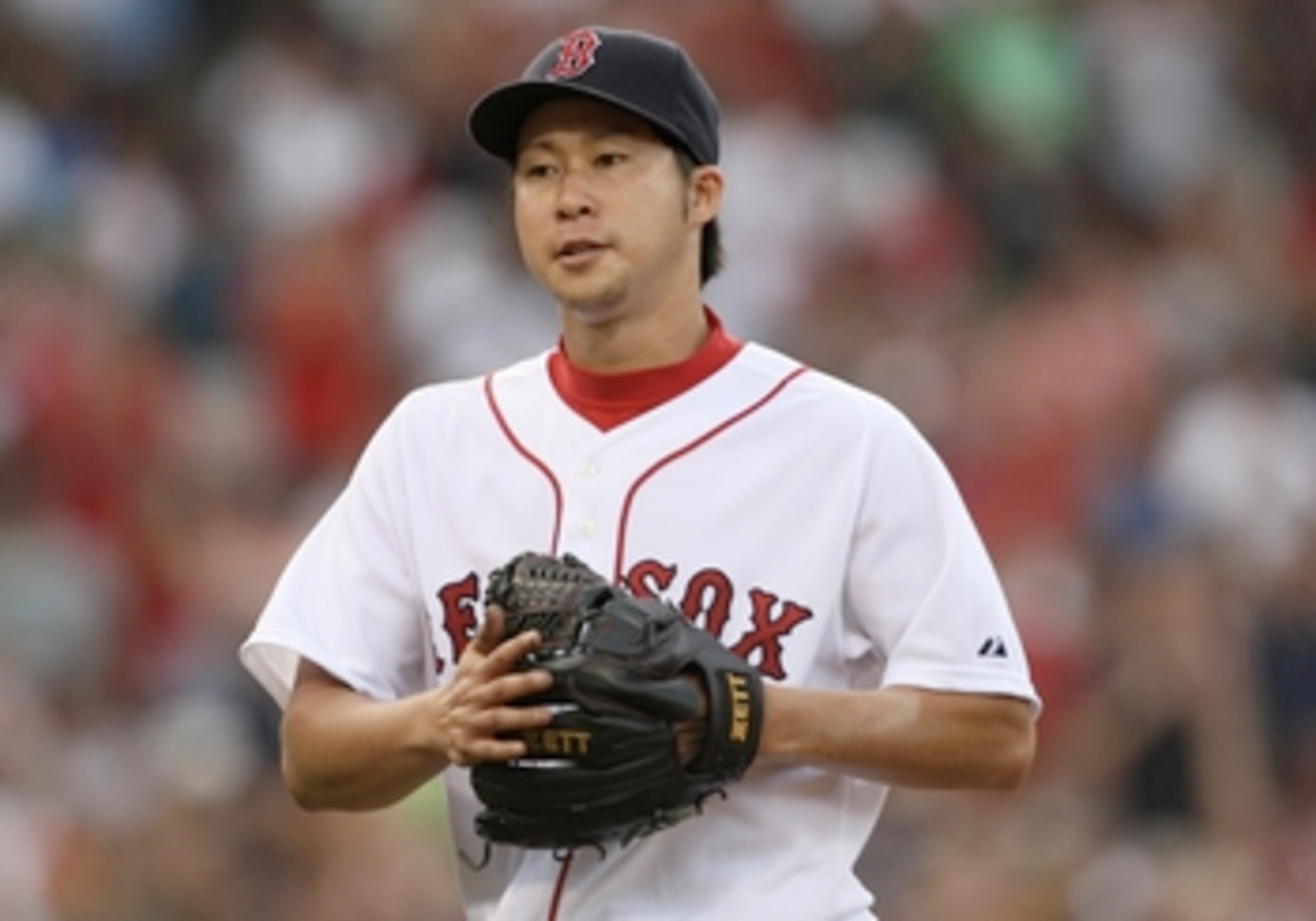 BOSTON - AUGUST 22:  Junichi Tazawa #63 of the Boston Red Sox walks off the mound during the game against the New York Yankees at Fenway Park on August 22, 2009 in Boston, Massachusetts. (Photo by Jim Rogash/Getty Images)