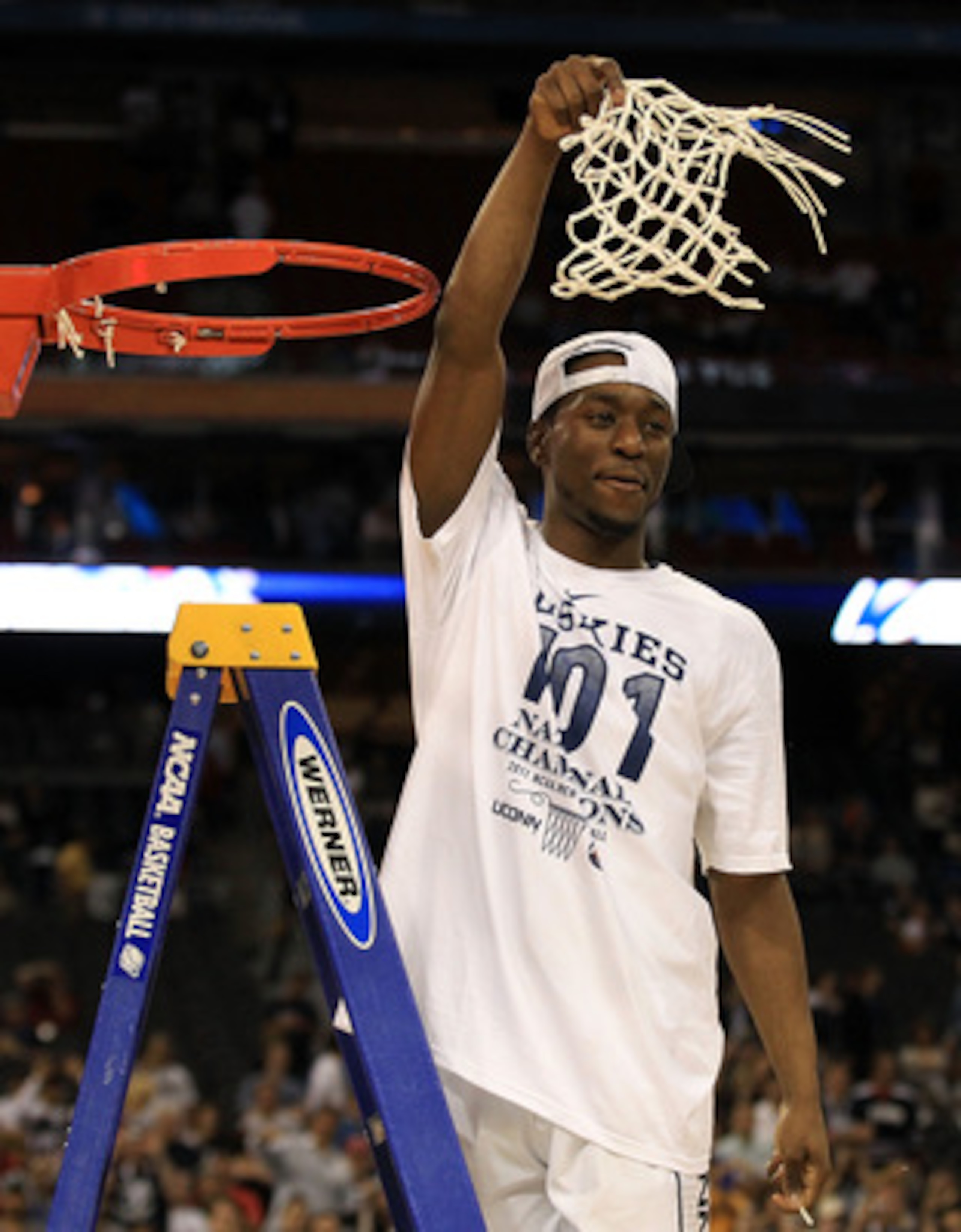 HOUSTON, TX - APRIL 04:  Kemba Walker #15 of the Connecticut Huskies cuts down the net after defeating the Butler Bulldogs to win the National Championship Game of the 2011 NCAA Division I Men's Basketball Tournament by a score of 53-41 at Reliant Stadium