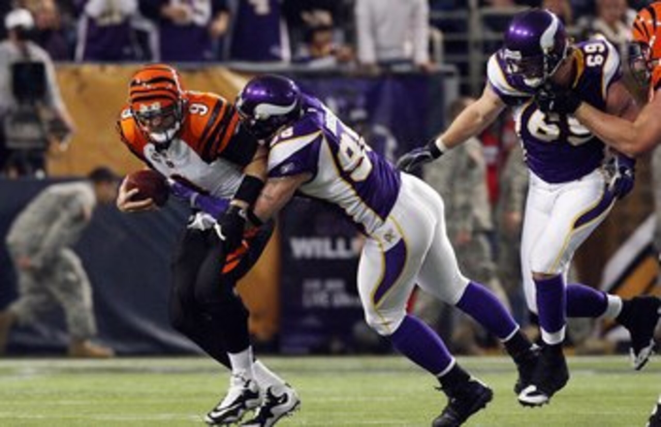 MINNEAPOLIS, MN - DECEMBER 13:  Carson Palmer #9 of the Cincinnati Bengals is sacked by Brian Robison #96 of the Minnesota Vikings on December 13, 2009 at Hubert H. Humphrey Metrodome in Minneapolis, Minnesota. (Photo by Elsa/Getty Images)  (Photo by Jim