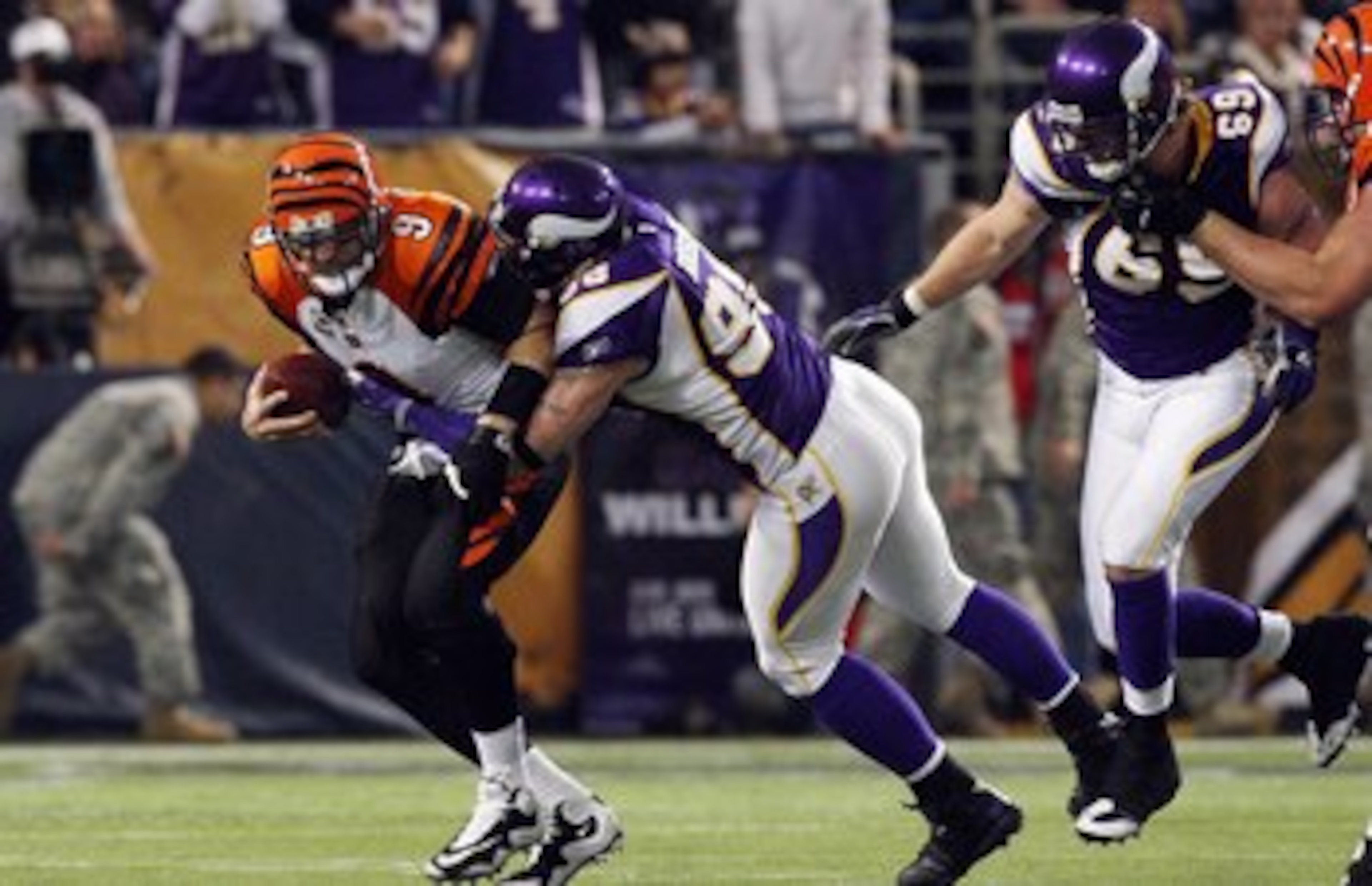 MINNEAPOLIS, MN - DECEMBER 13:  Carson Palmer #9 of the Cincinnati Bengals is sacked by Brian Robison #96 of the Minnesota Vikings on December 13, 2009 at Hubert H. Humphrey Metrodome in Minneapolis, Minnesota. (Photo by Elsa/Getty Images)  (Photo by Jim