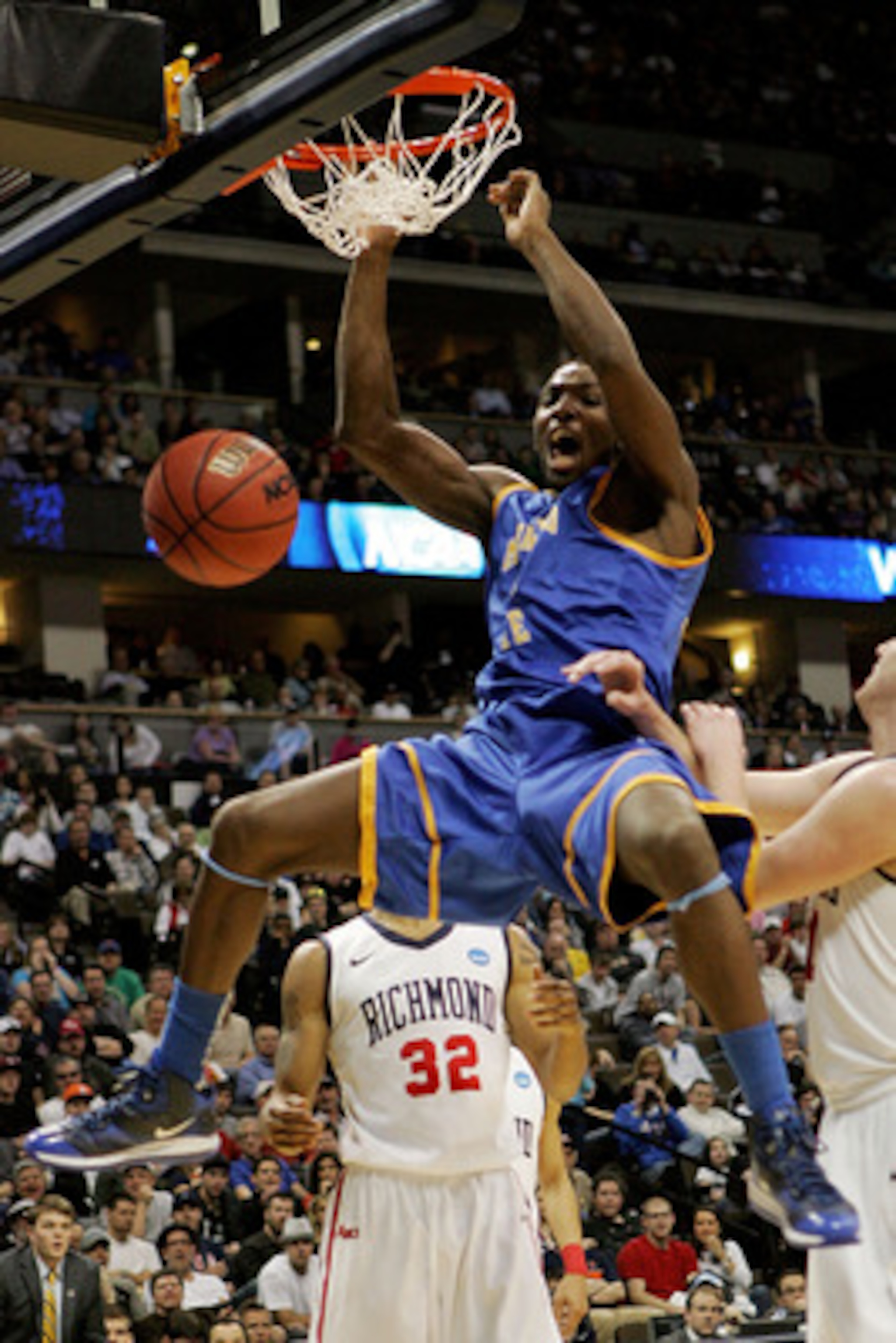 DENVER, CO - MARCH 19:  Kenneth Faried #35 of the Morehead State Eagles dunks the ball against the Richmond Spiders during the third round of the 2011 NCAA men's basketball tournament at Pepsi Center on March 19, 2011 in Denver, Colorado.  (Photo by Justi