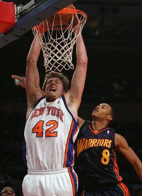 NEW YORK - NOVEMBER 20: David Lee #42 of the New York Knicks dunks the ball despite the block attempt from Monta Ellis #8 of Golden State Warriors at Madison Square Garden on November 20, 2007 in New York City.  NOTE TO USER: User expressly acknowledges a