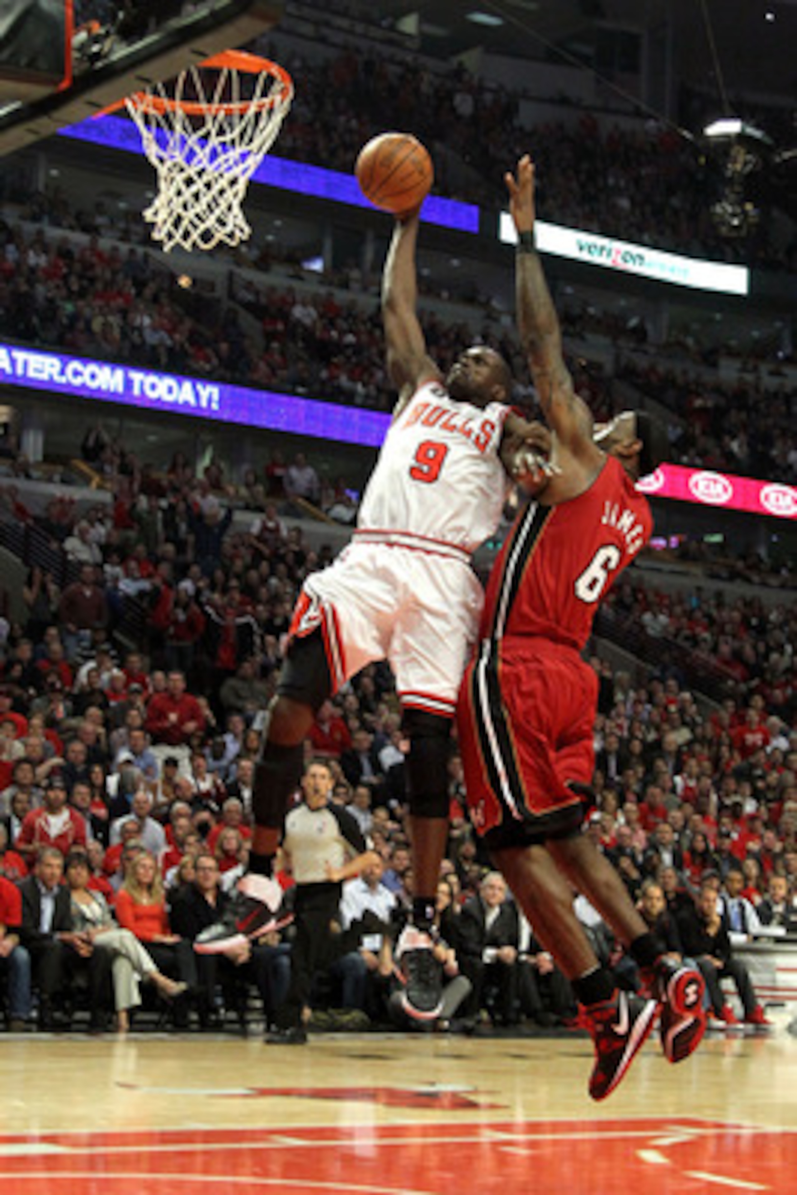 CHICAGO, IL - MAY 26:  Luol Deng #9 of the Chicago Bulls dunks against LeBron James #6 of the Miami Heat in Game Five of the Eastern Conference Finals during the 2011 NBA Playoffs on May 26, 2011 at the United Center in Chicago, Illinois. NOTE TO USER: Us