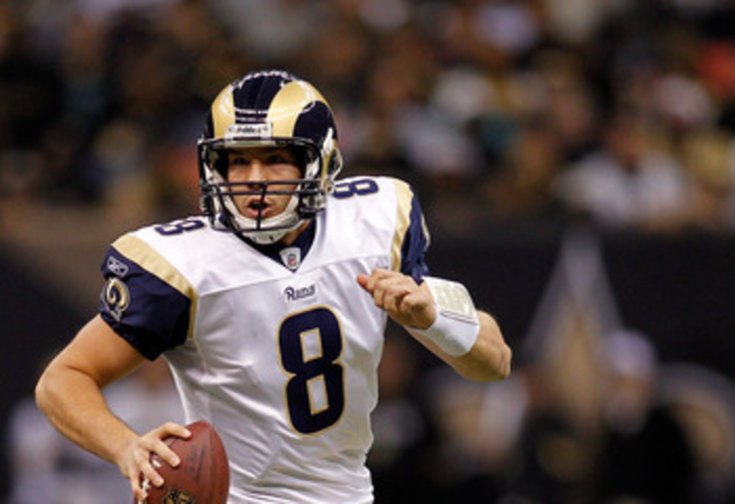 NEW ORLEANS, LA - DECEMBER 12:  Quarterback Sam Bradford #8 of the St. Louis Rams looks to throw a pass during the game against the New Orleans Saints at the Louisiana Superdome on December 12, 2010 in New Orleans, Louisiana. The Saints defeated the Rams 