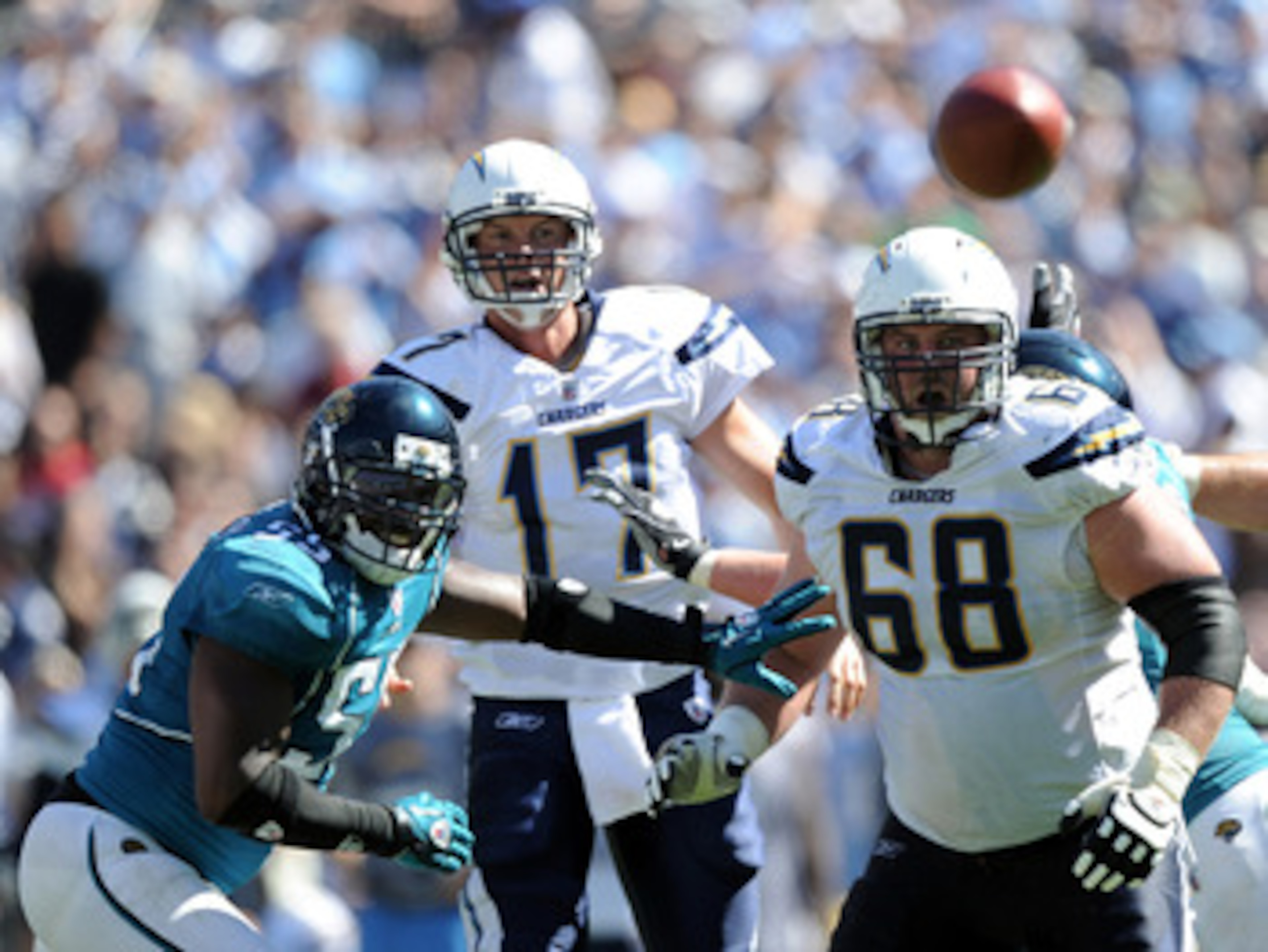 SAN DIEGO - SEPTEMBER 19:  Philip Rivers #17 of the San Diego Chargers watches his pass with Kris Dielman #68 and Kirk Morrison #55 of the Jacksonville Jaguars during the game at Qualcomm Stadium on September 19, 2010 in San Diego, California.  (Photo by