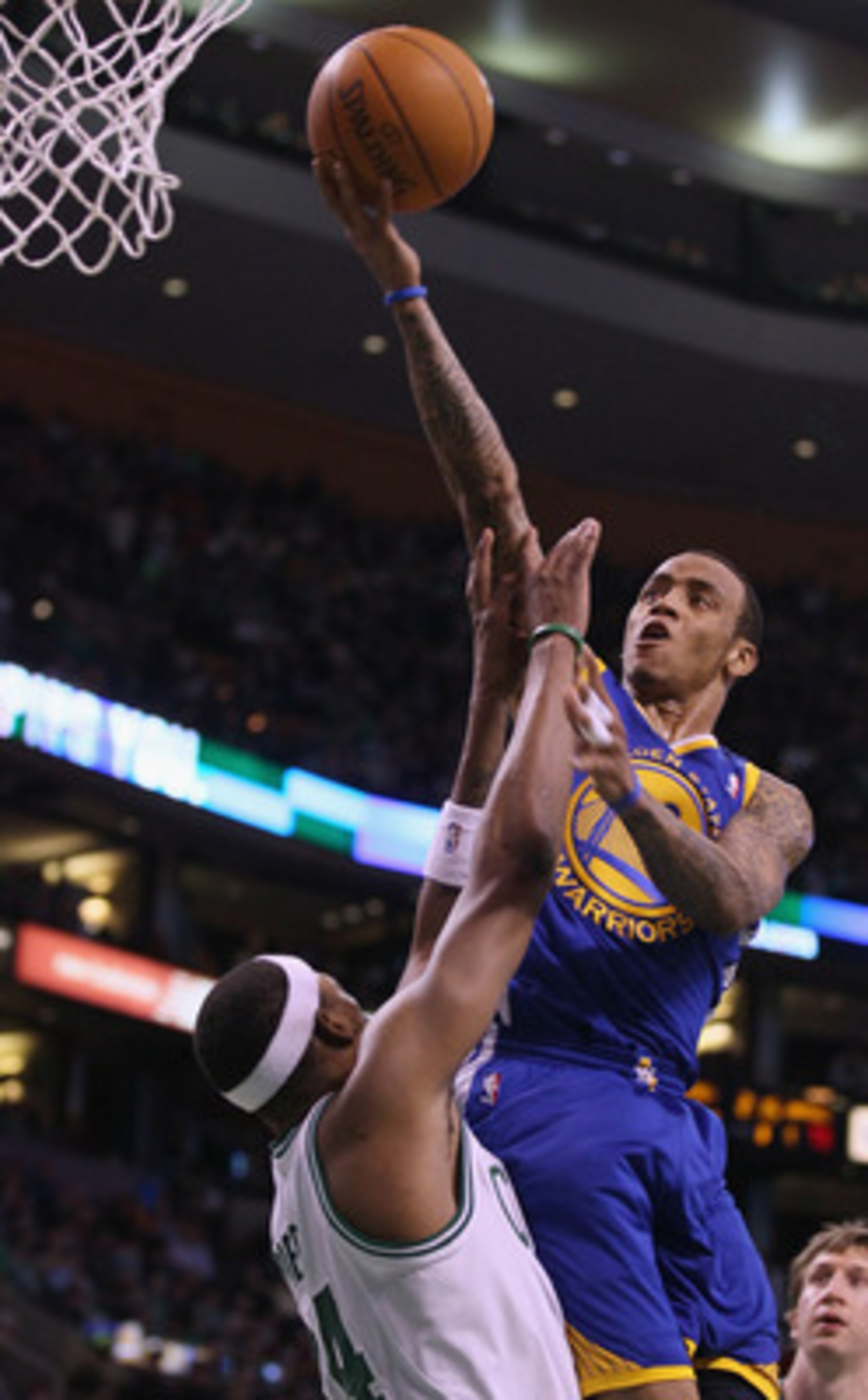 BOSTON, MA - MARCH 04:  Monta Ellis #8 of the Golden State Warriors takes a shot over Paul Pierce #34 of the Boston Celtics on March 4, 2011 at the TD Garden in Boston, Massachusetts.  The Celtics defeated the Warriors 107-103. NOTE TO USER: User expressl