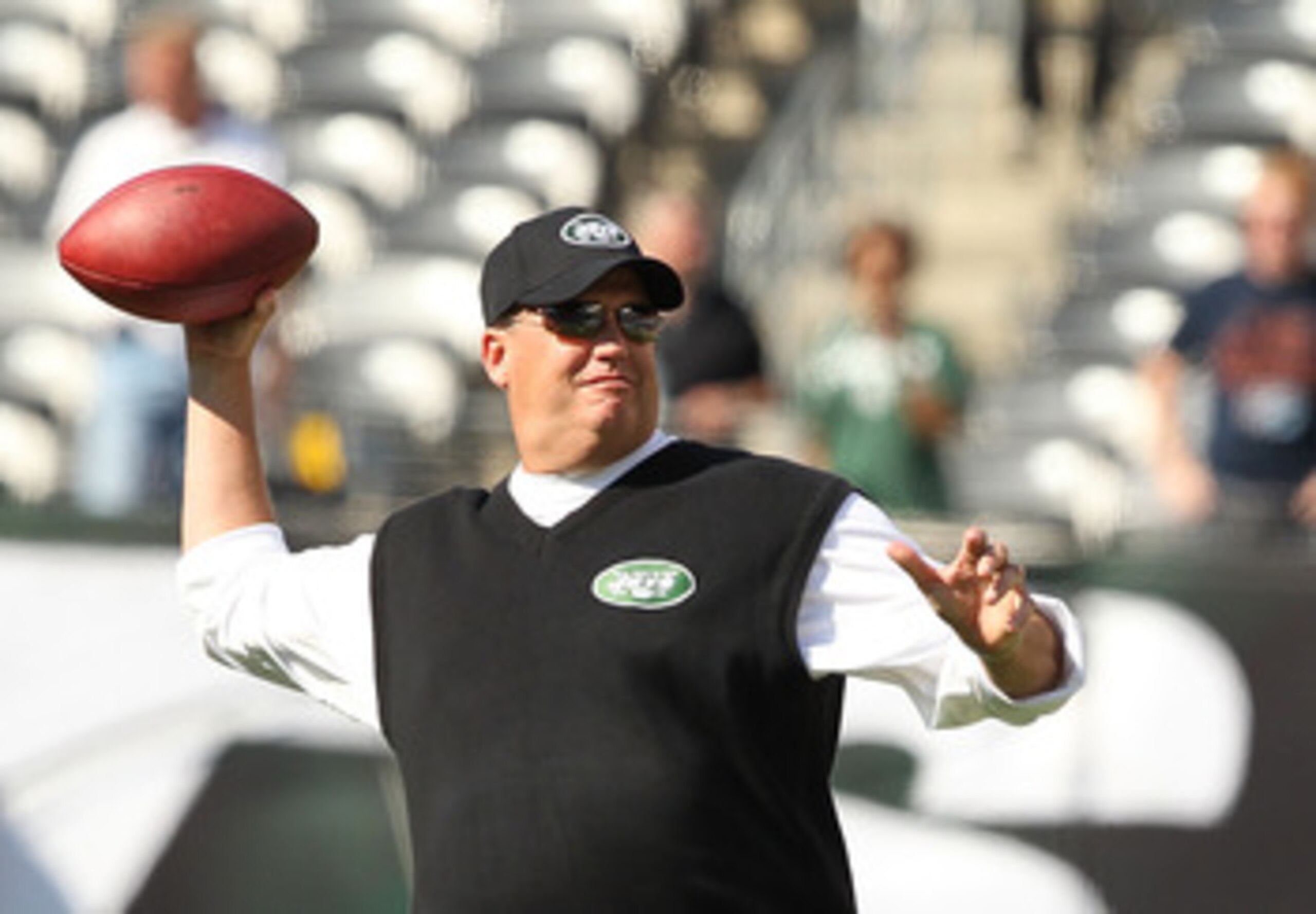 EAST RUTHERFORD, NJ - SEPTEMBER 19:  Rex Ryan, Head Coach of the New York Jets throws passes before the game against the New England Patriots on September 19, 2010 at the New Meadowlands Stadium  in East Rutherford, New Jersey.  (Photo by Al Bello/Getty I