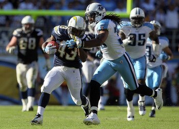 SAN DIEGO - OCTOBER 31:  Running back Darren Sproles #43 of the San Diego Chargers is pursued by Michael Griffin #33 of the Tennessee Titans in the game at Qualcomm Stadium on October 31, 2010 in San Diego, California. The Chargers defeated the Titans 33-