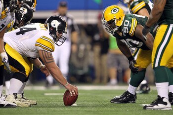 ARLINGTON, TX - FEBRUARY 06:  Doug Legursky #64 of the Pittsburgh Steelers readies to snap the ball at the line of scrimmage against B.J. Raji #90 of the Green Bay Packers during Super Bowl XLV at Cowboys Stadium on February 6, 2011 in Arlington, Texas.