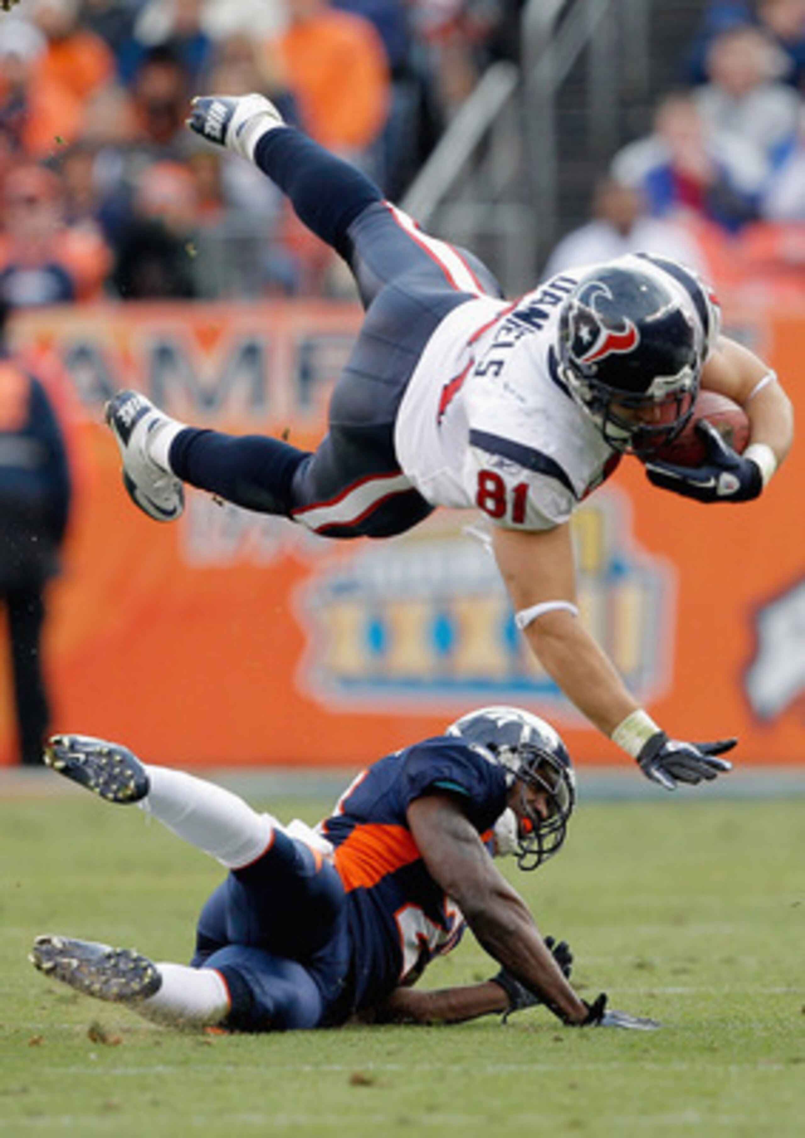 DENVER - DECEMBER 26: Tight end Owen Daniels #81 of the Houston Texans gets up-ended by cornerback Andre' Goodman #21 of the Denver Broncos during the first quarter at INVESCO Field at Mile High on December 26, 2010 in Denver, Colorado. (Photo by Justin DENVER - DECEMBER 26: Tight end Owen Daniels #81 of the Houston Texans gets up-ended by cornerback Andre' Goodman #21 of the Denver Broncos during the first quarter at INVESCO Field at Mile High on December 26, 2010 in Denver, Colorado. (Photo by Justin